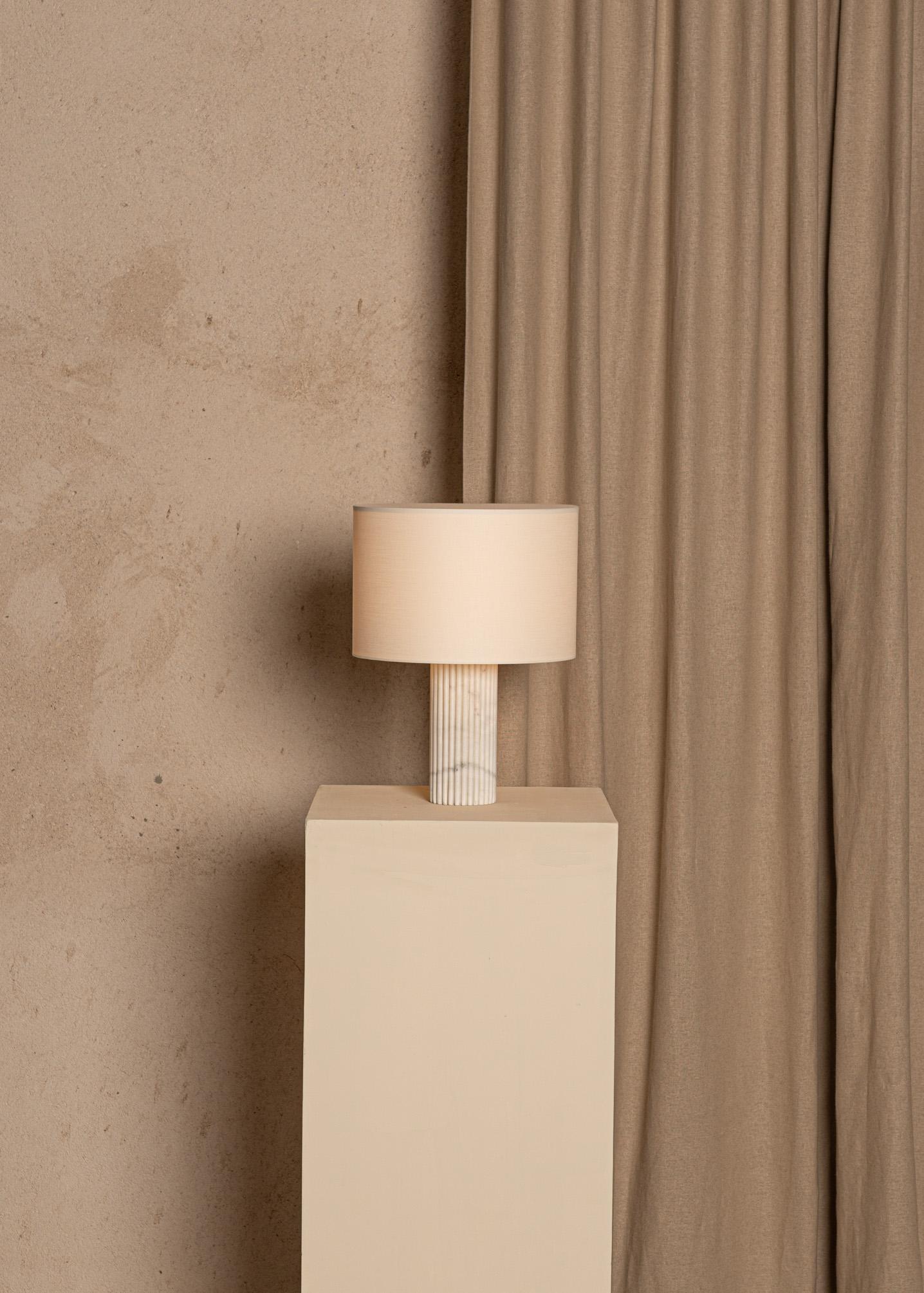 White Marble Flutita Table Lamp by Simone & Marcel
Dimensions: Ø 30 x H 40 cm.
Materials: Cotton and white marble.

Also available in different marble and wood options and finishes. Custom options available on request. Please contact us. 

All our