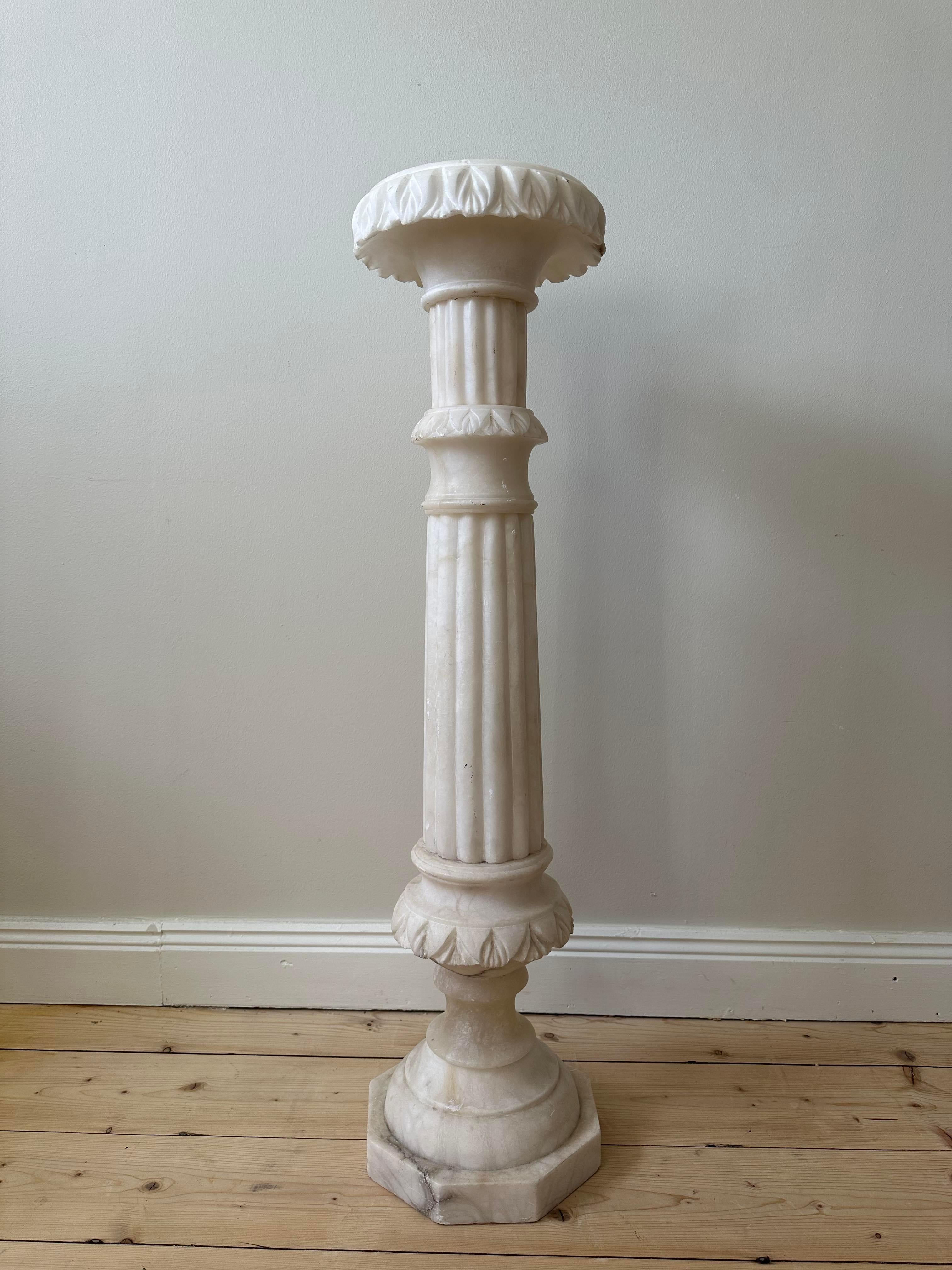 White marble pedestal. 