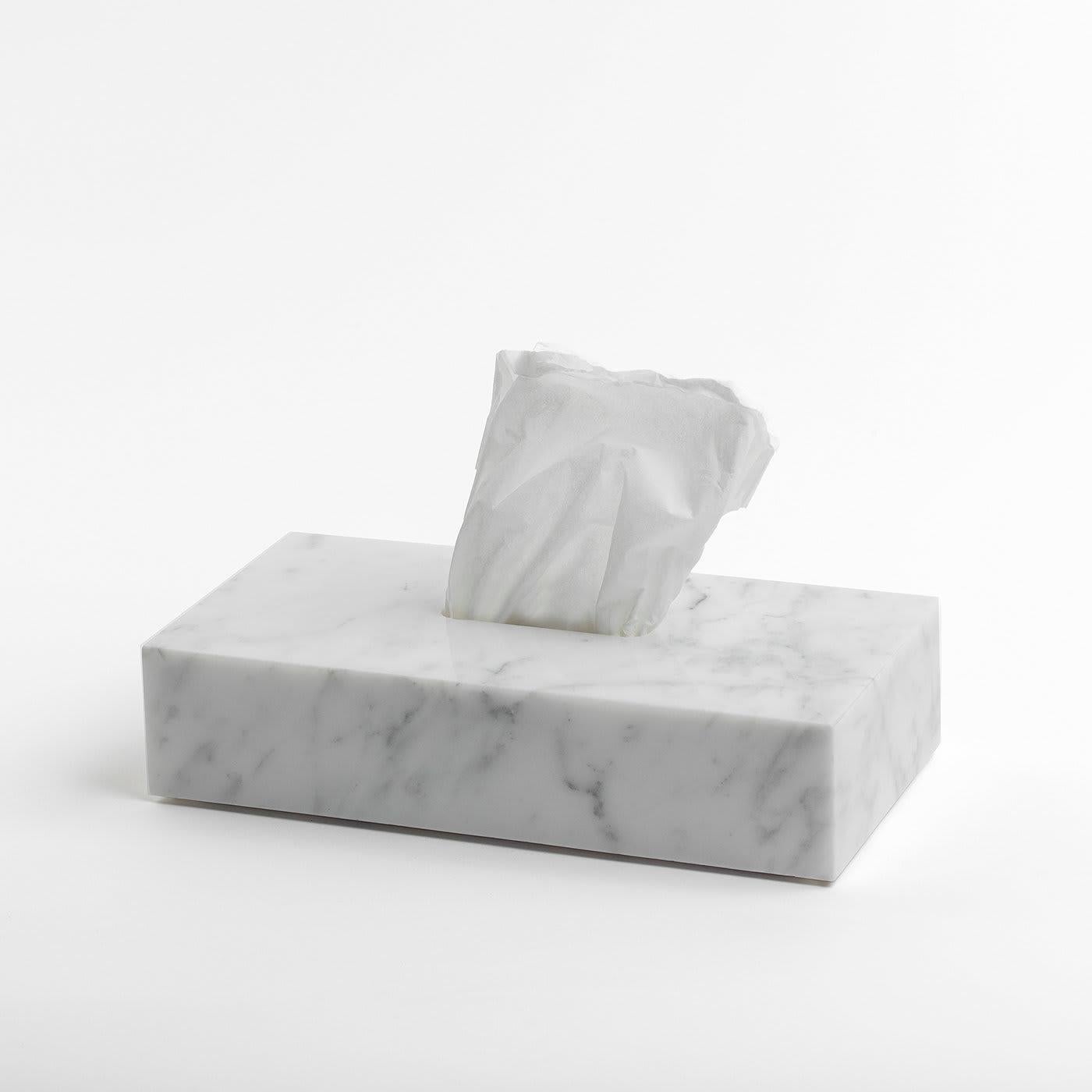 A sophisticated way to have the convenience of a box of tissues displayed anywhere in the home, this white marble box cover will fit over a standard tissue box, creating an elegant accent in a study, bedroom, bathroom, or living room. A slit at the