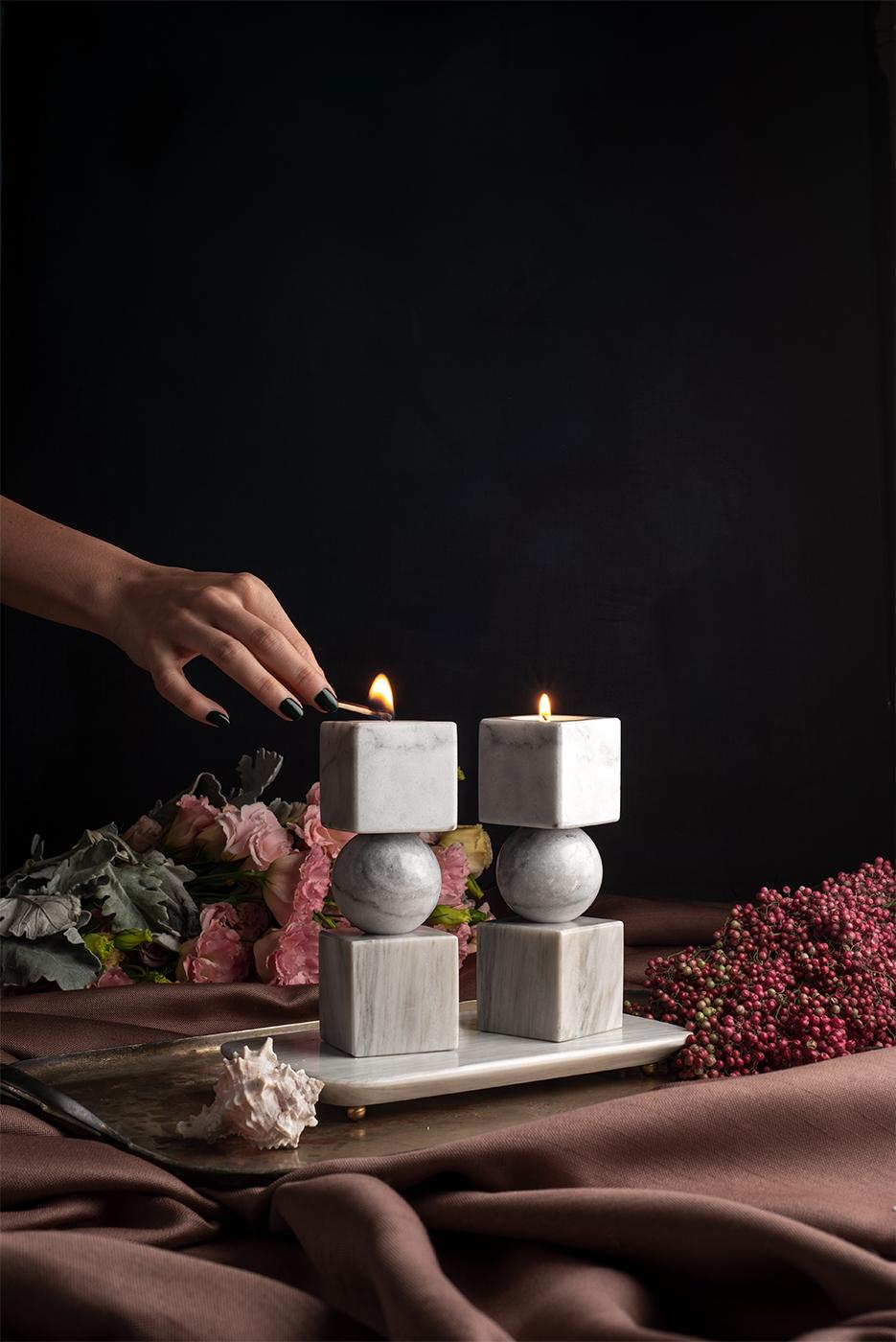 Elevate your ambiance with the captivating allure of bruci's Totem Candle Holders, a sublime sculptural masterpiece destined to adorn any refined setting. This decorative set, meticulously crafted by skilled artisans, transcends conventional