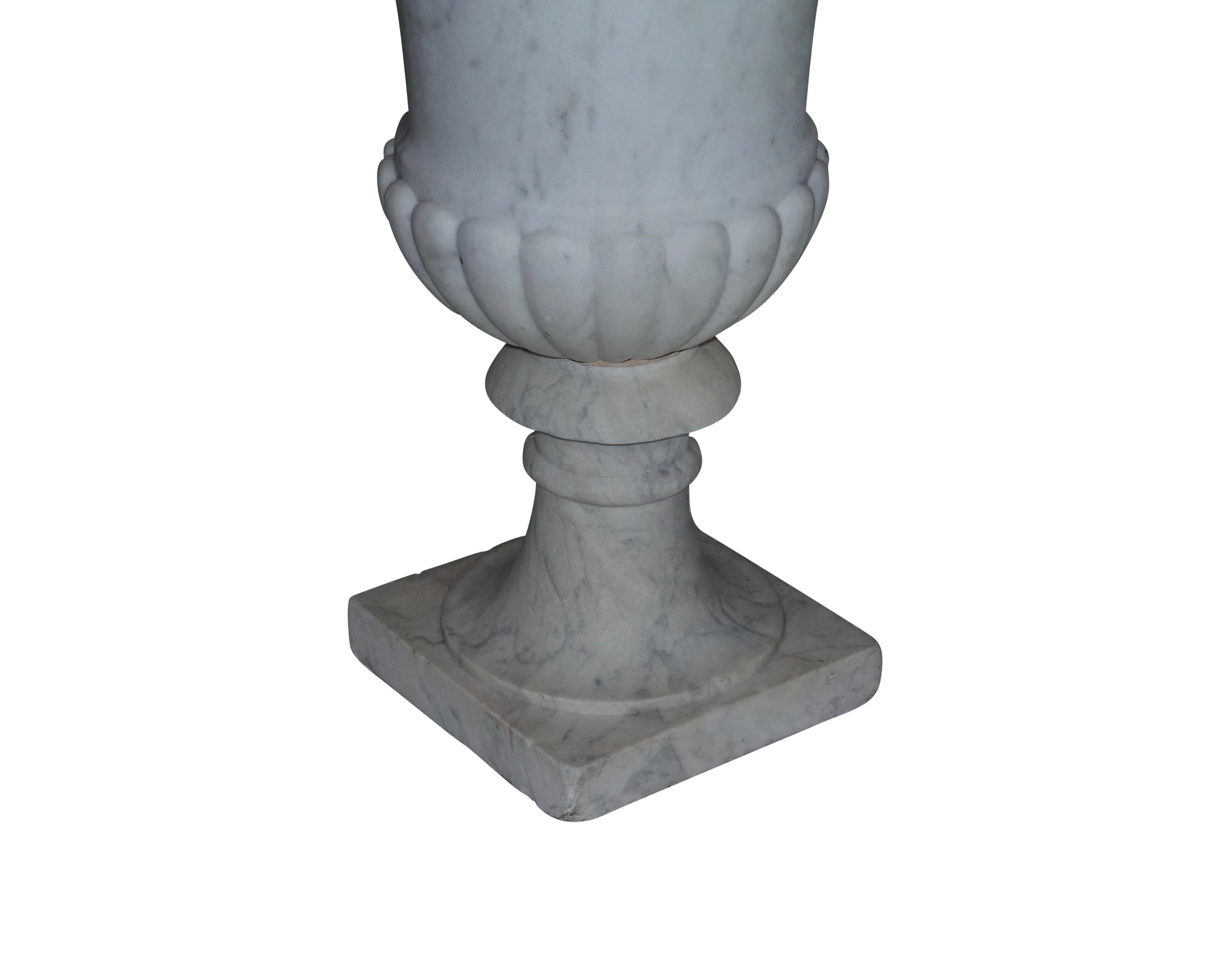 white marble urns