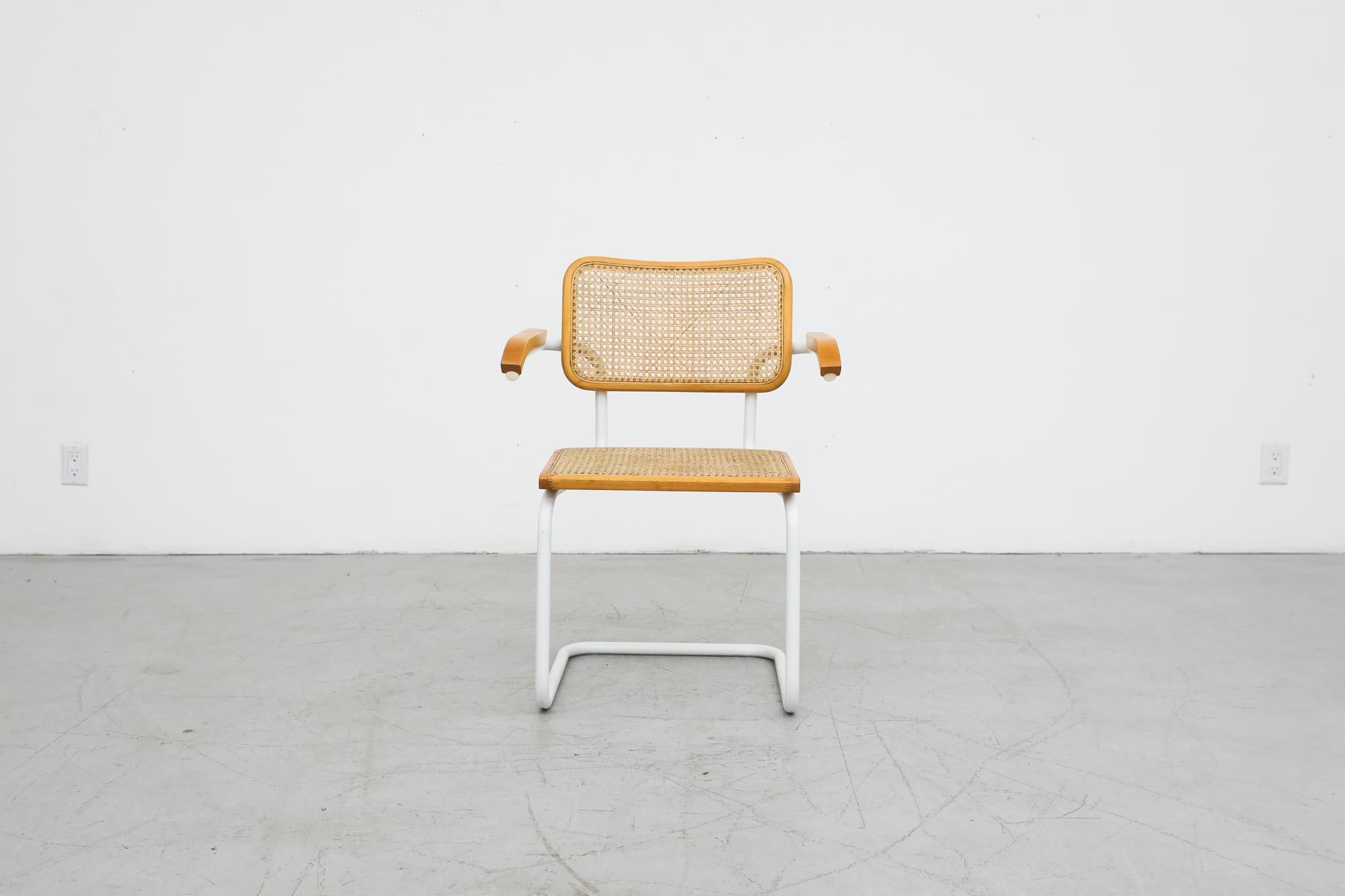 Charming 'B64' Cesca Chair by Marcel Breuer for Gavina Italy, circa 1960s. Named after his daughter Francesca the 'Cesca' is an attractive side or dining chair on a white painted metal frame with oak wood trim and cane seat and back rest. In