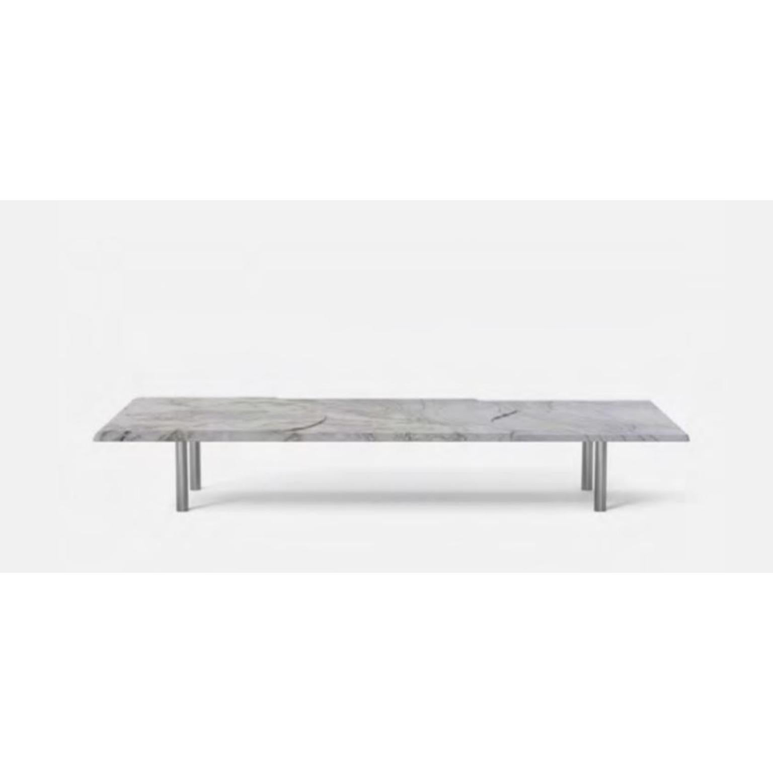 White Maré Coffee Table by Wentz
Dimensions: D 80 x W 160 x H 25 cm
Materials: Granite, Steel.
Also available in Black Brazilian Granite, White Brazilian Quartzite.

The Mesa Centro Maré portrays a phenomenon of water transition. The table top is