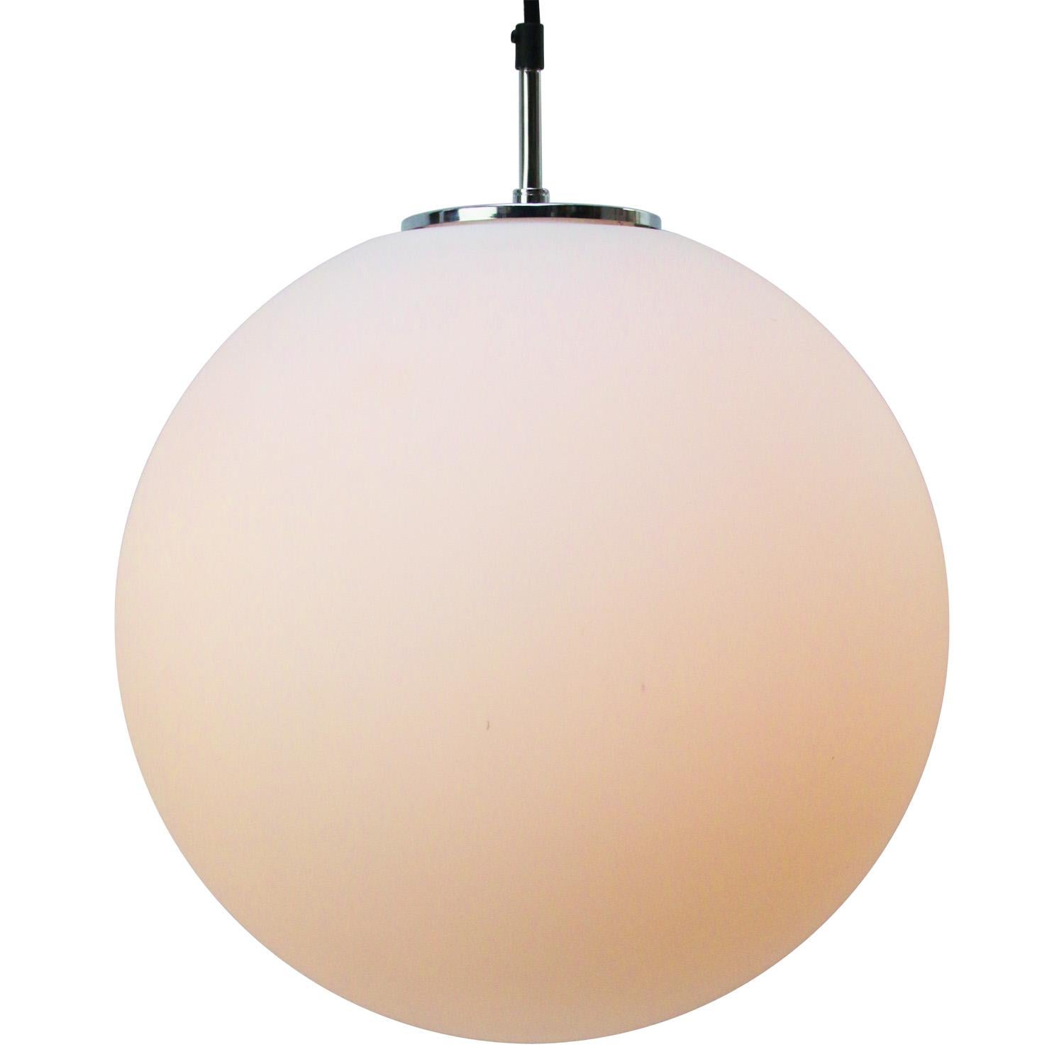 Large round mat opaline glass pendant by Glashütte Limburg Duitsland
2 meter black cotton wire
Chrome top

Weight: 2.50 kg / 5.5 lb

Priced per individual item. All lamps have been made suitable by international standards for incandescent light