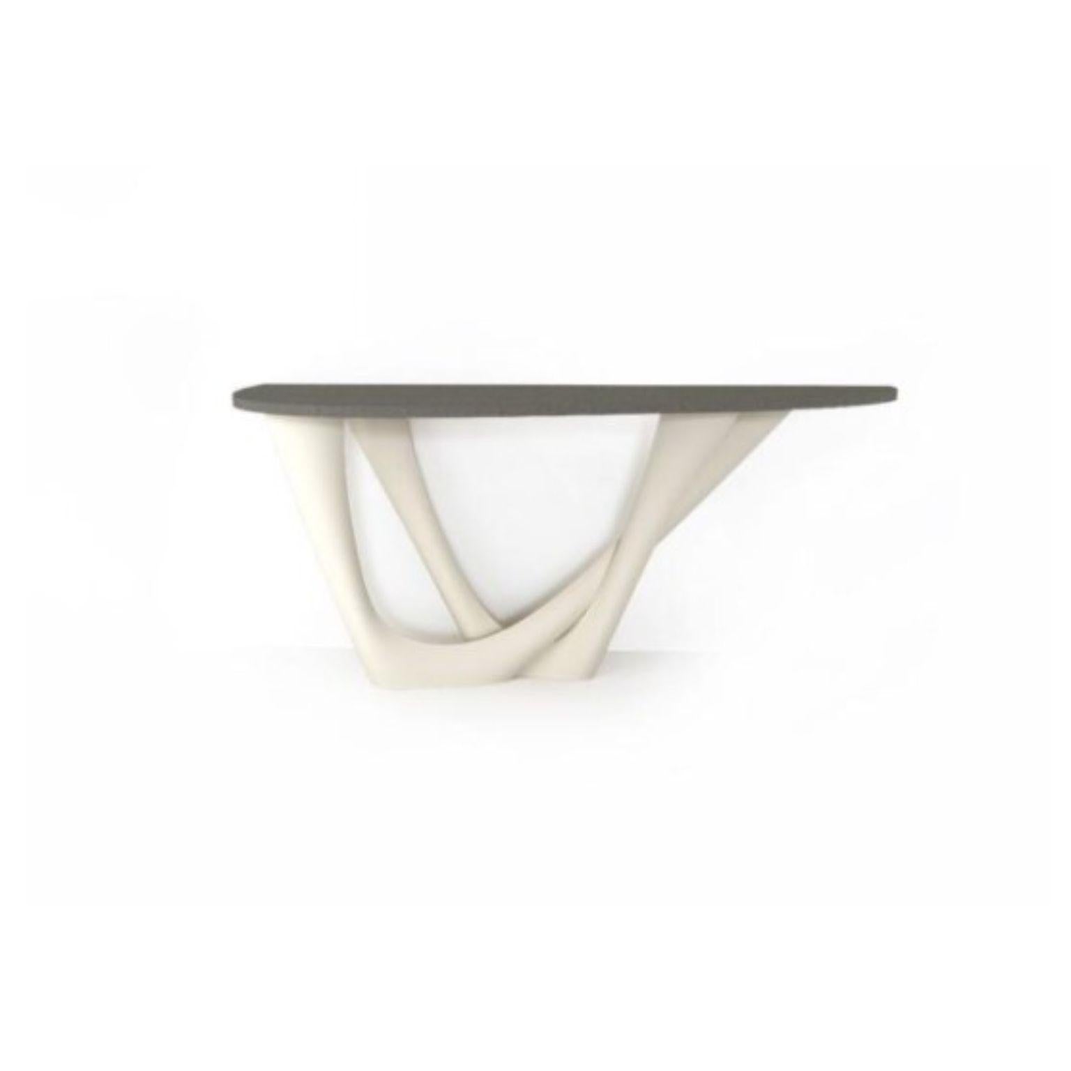 White Matt G-console duo concrete top and steel base by Zieta
Dimensions: D 56 x W 168 x H 75 cm 
Material: Carbon steel, concrete.
Also available in different colors and dimensions.

G-Console is another bionic object in our collection. Created for