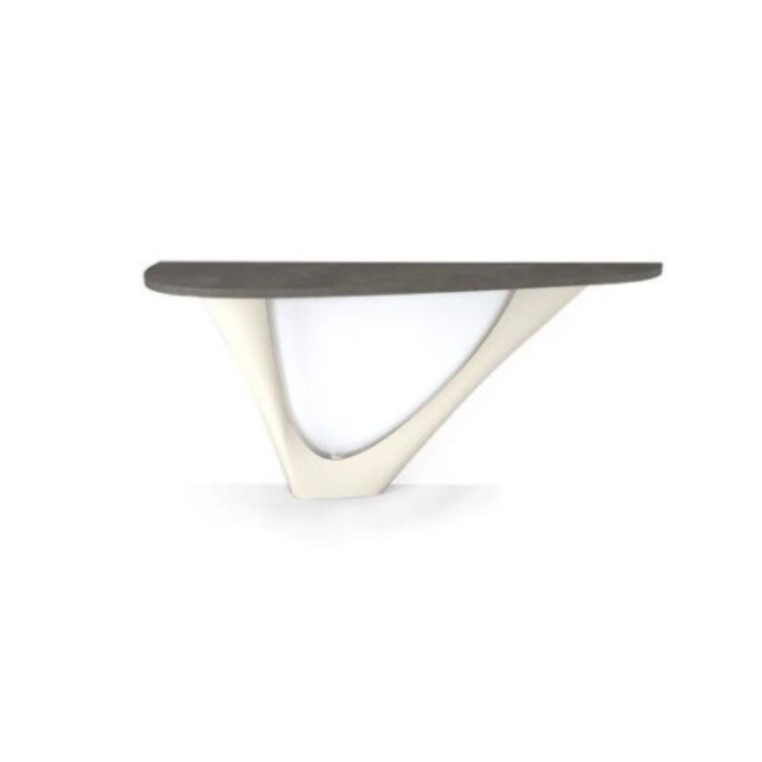 White matt G-console mono steel base with concrete top by Zieta
Dimensions: D 43 x W 159 x H 75 cm 
Material: Concrete, carbon steel.
Also available in different colors and dimensions.

G-Console is another bionic object in our collection. Created