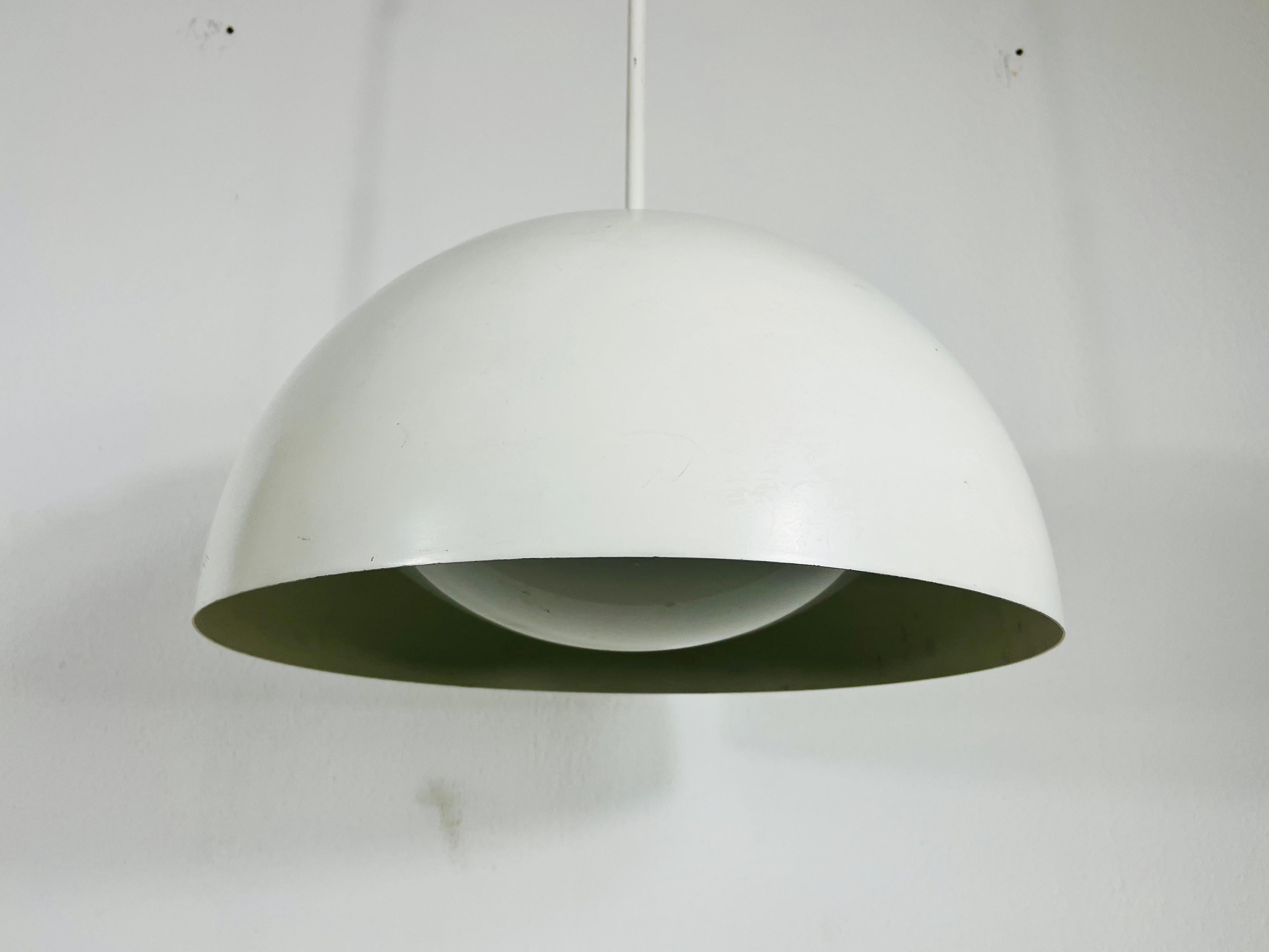 Vintage pendant lamp in the style of Temde in the 1970s. It is made from glass and metal.

Measures: 

Height: 25-120 cm

Diameter: 45 cm 

The light requires one E27 light bulb. Works with both 120/220V. Good vintage condition.

Free