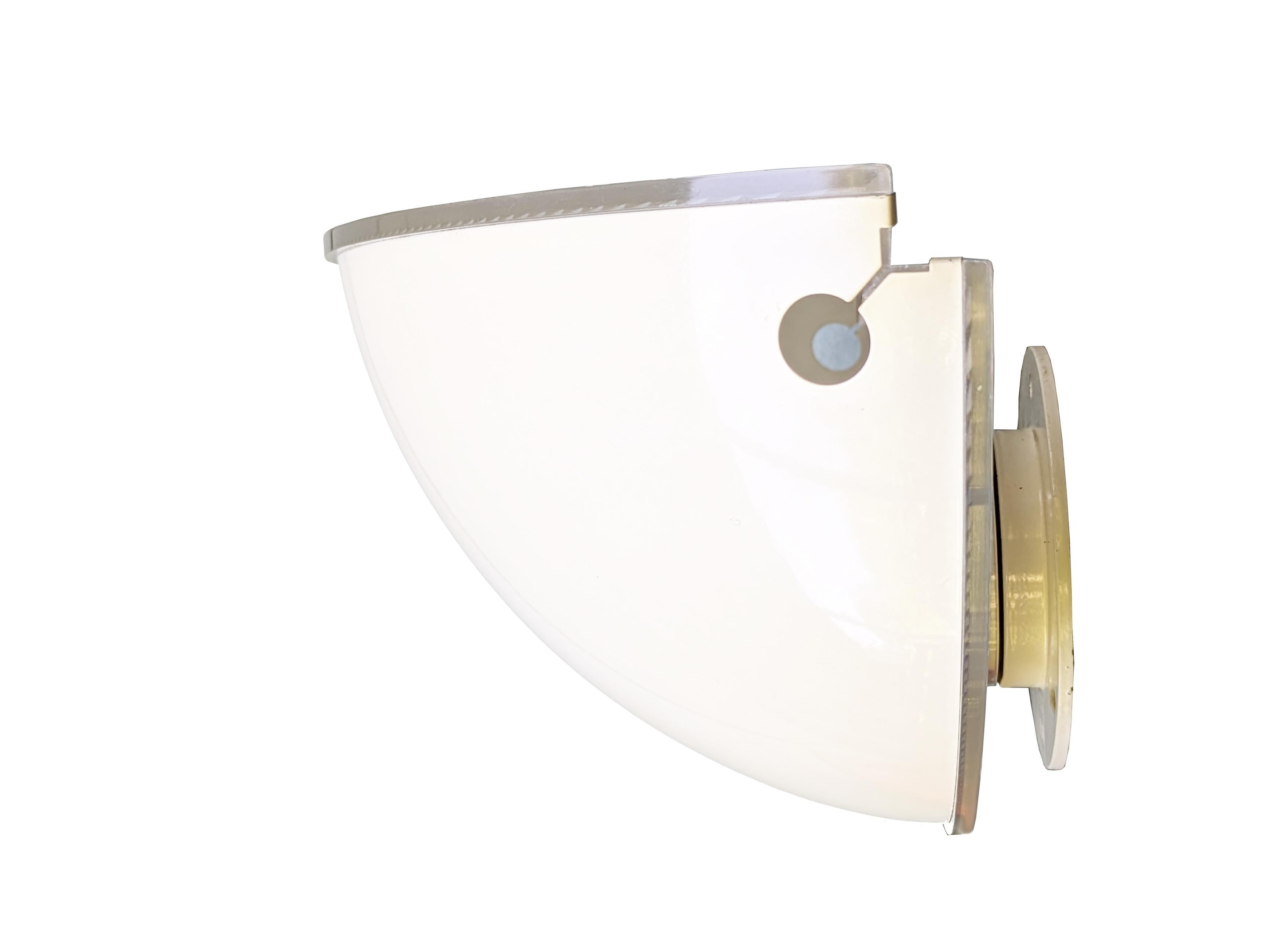 White Metal shade and clear polycarbonate frame wall lamp by Flos, 1970s.
Good condition: one visible ossidation on the plastic on the upper side at the light bulb: the plastic is not deformed, but has a slight oxidation halo.
4 very small paint