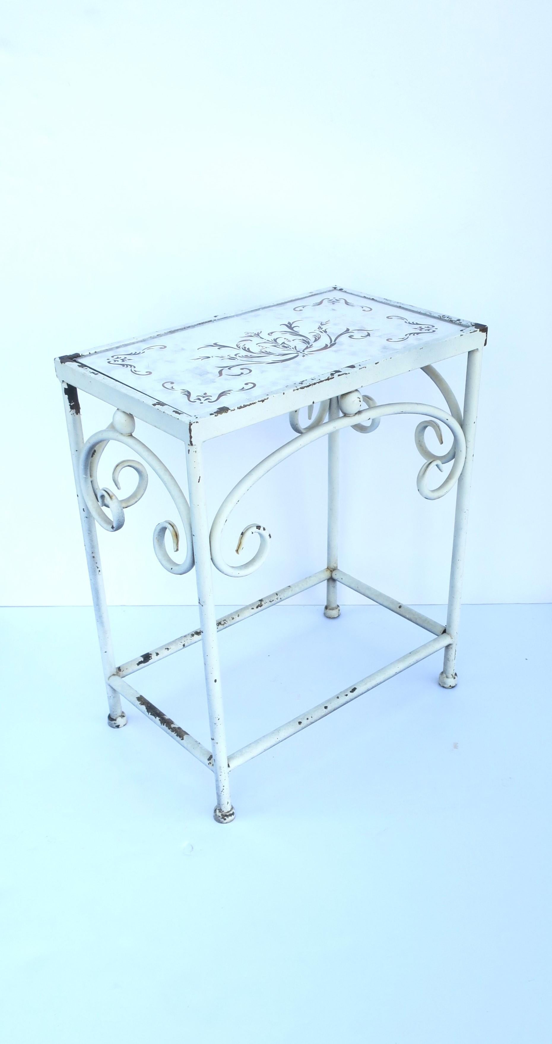 A painted white lightweight metal small side/drinks table with inset mirrored glass top with decorative design, circa mid-20th century. A convenient small table indoors or outside patio/porch. Dimensions: 8.63