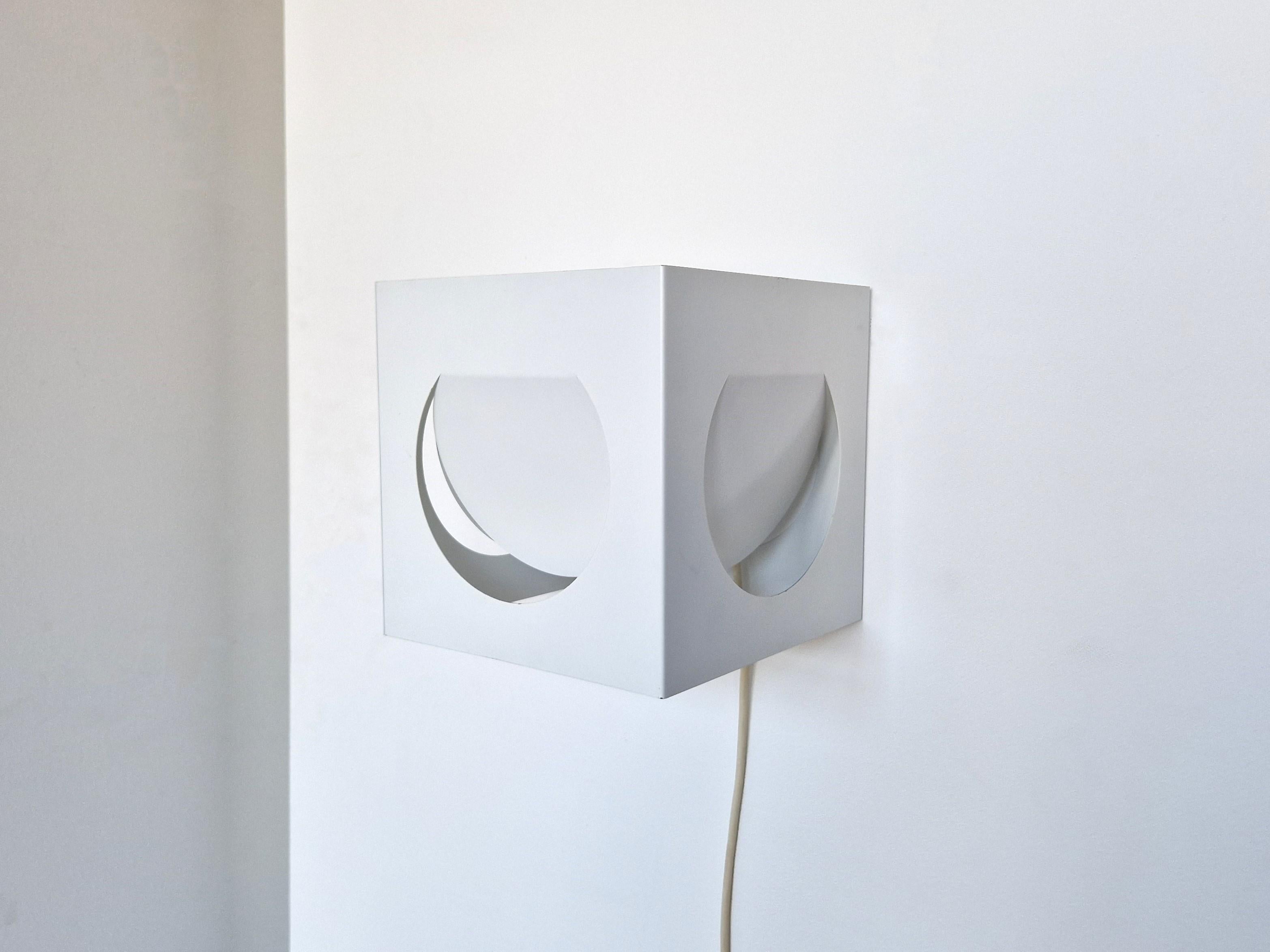 This geometric shaped wall sconce was designed by Shogo Suzuki for Orno in the early 1960's. It was designed after an exchange project beween Finnish and Japanese designers. Shogo Suzuki came to work with Lisa Johansson Pape at Orno. The lamp has