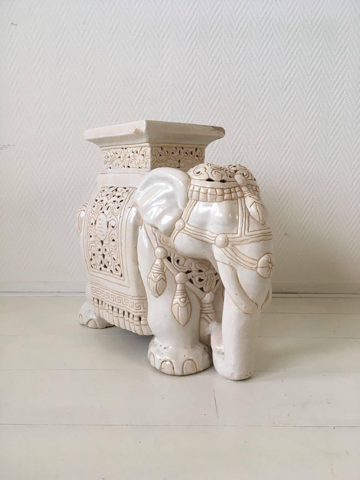 This Asian elephant was manufactured, circa 1960s-1970s and features a Classic design with rare colors. Very often, items like these feature multiple colors while this one was kept very basic in white and sand. On top, there is, what seems to be, a