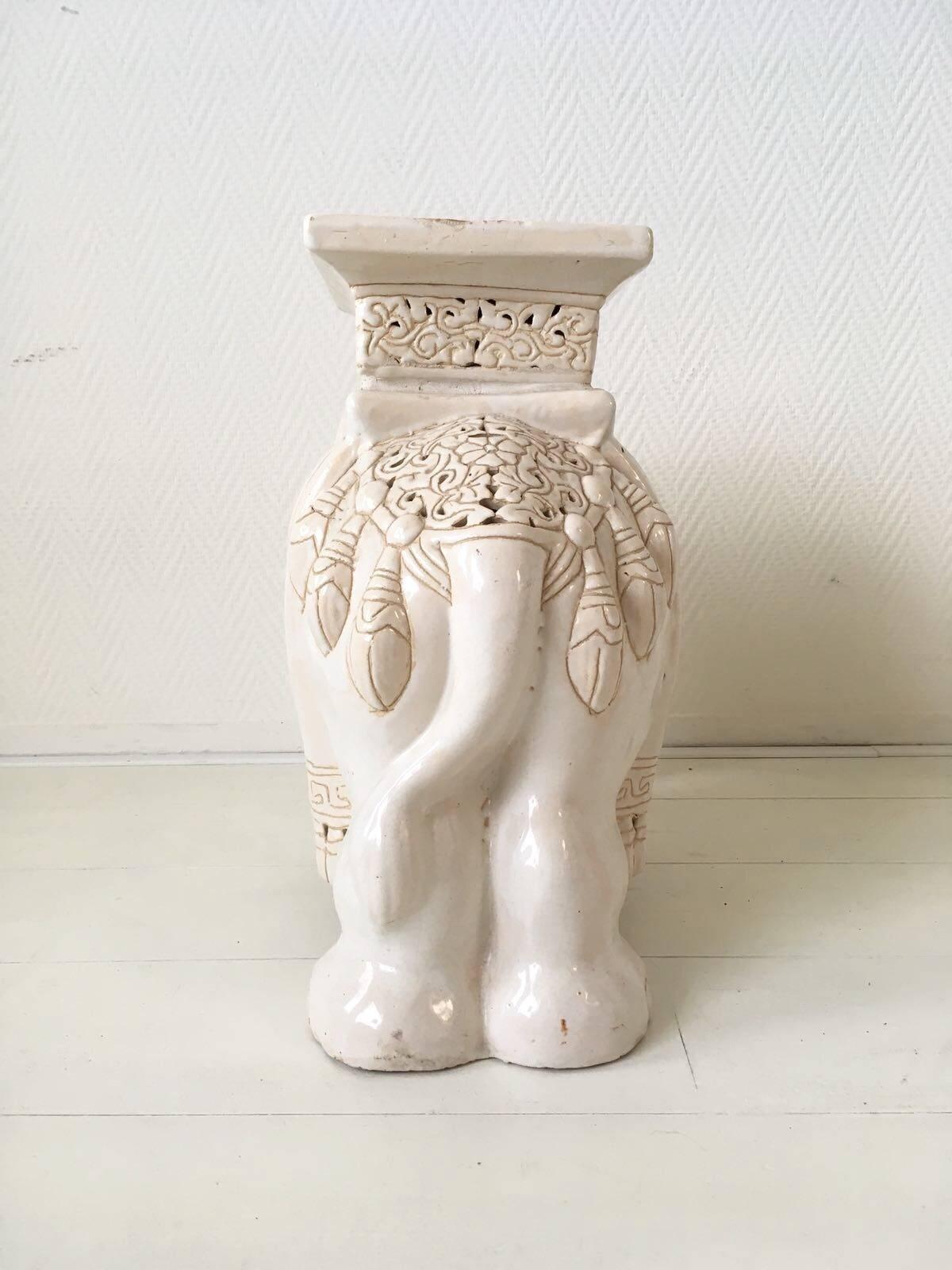 white ceramic elephant plant stand