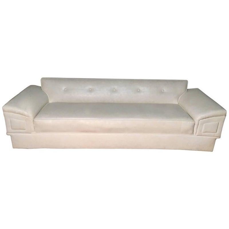 White Mid-Century Modern Sofa  - This is a classic Mid-Century Sofa Frame.  We have marked this to sell as the frame is upholstered in vinyl and rather than restoring ourselves we want to pass savings along to a customer with a vision - *the current
