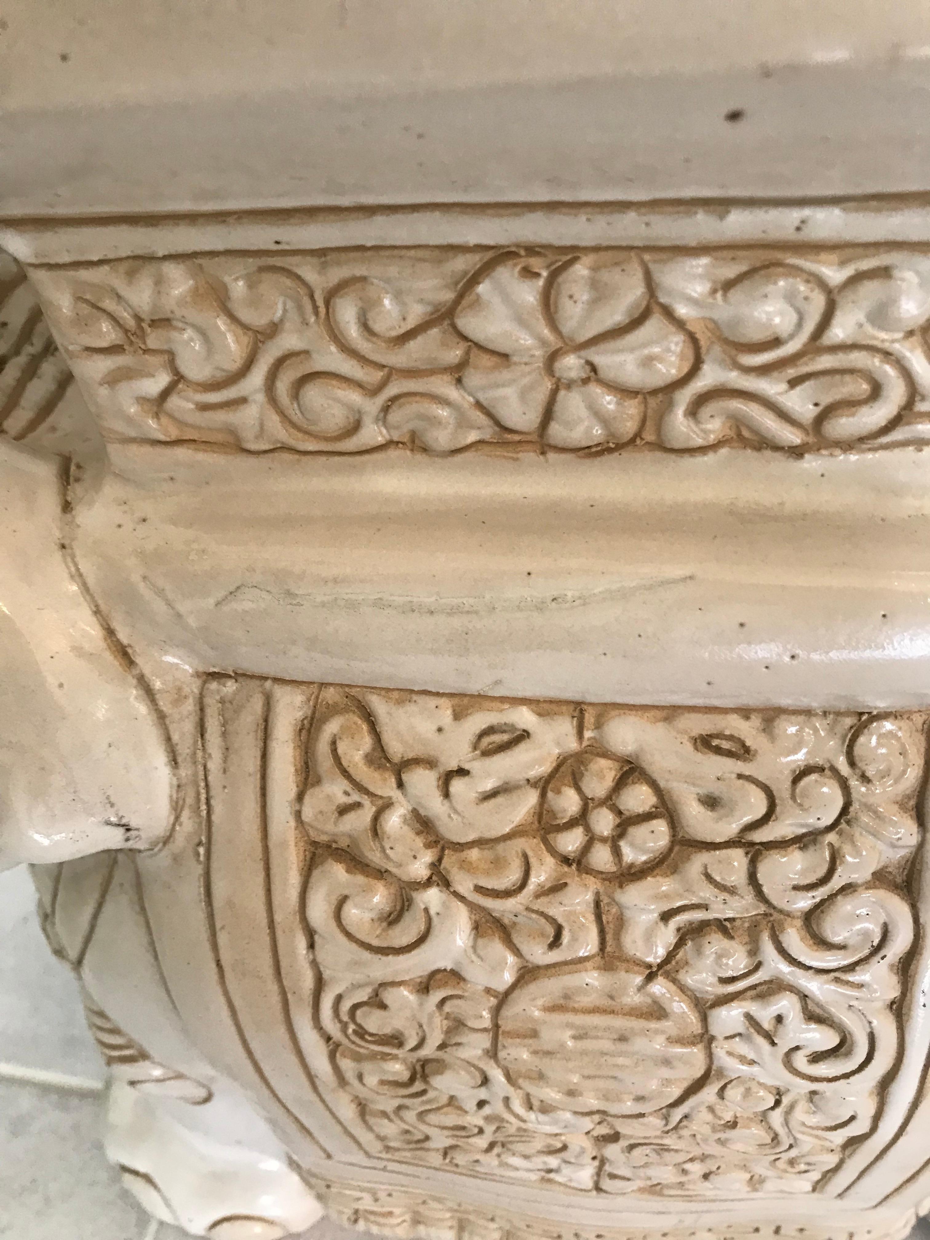 white ceramic elephant side table