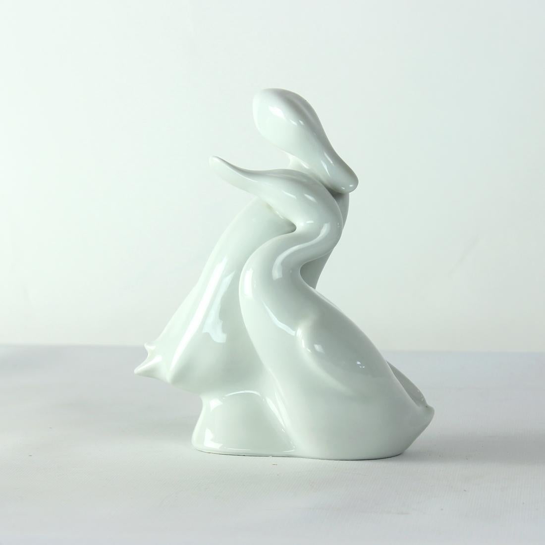 Beautiful midcentury modern statue produced by Royal Dux, a porcelain producer company from Czechoslovakia. this statue was produced in 1960s and has remained in perfect condition without any chips or damages. The statue stands on itself and