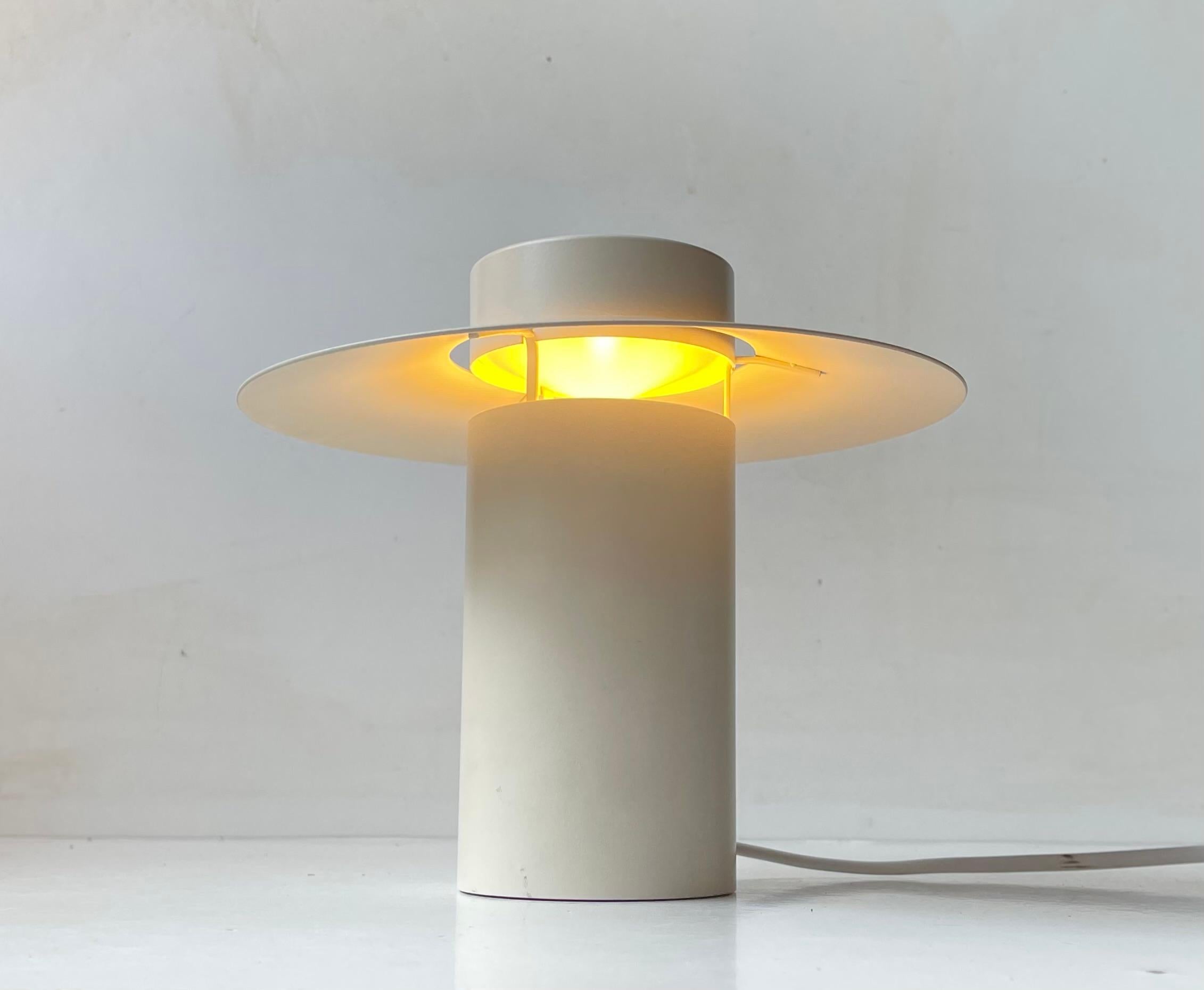 Small simplistically constructed Table Light in white powder coated steel. Designed by danish Architect Jørgen Møller and manufactured by Georg Jensen and Royal Copenhagen. It is called Limelight and this is the small version manufactured by Royal