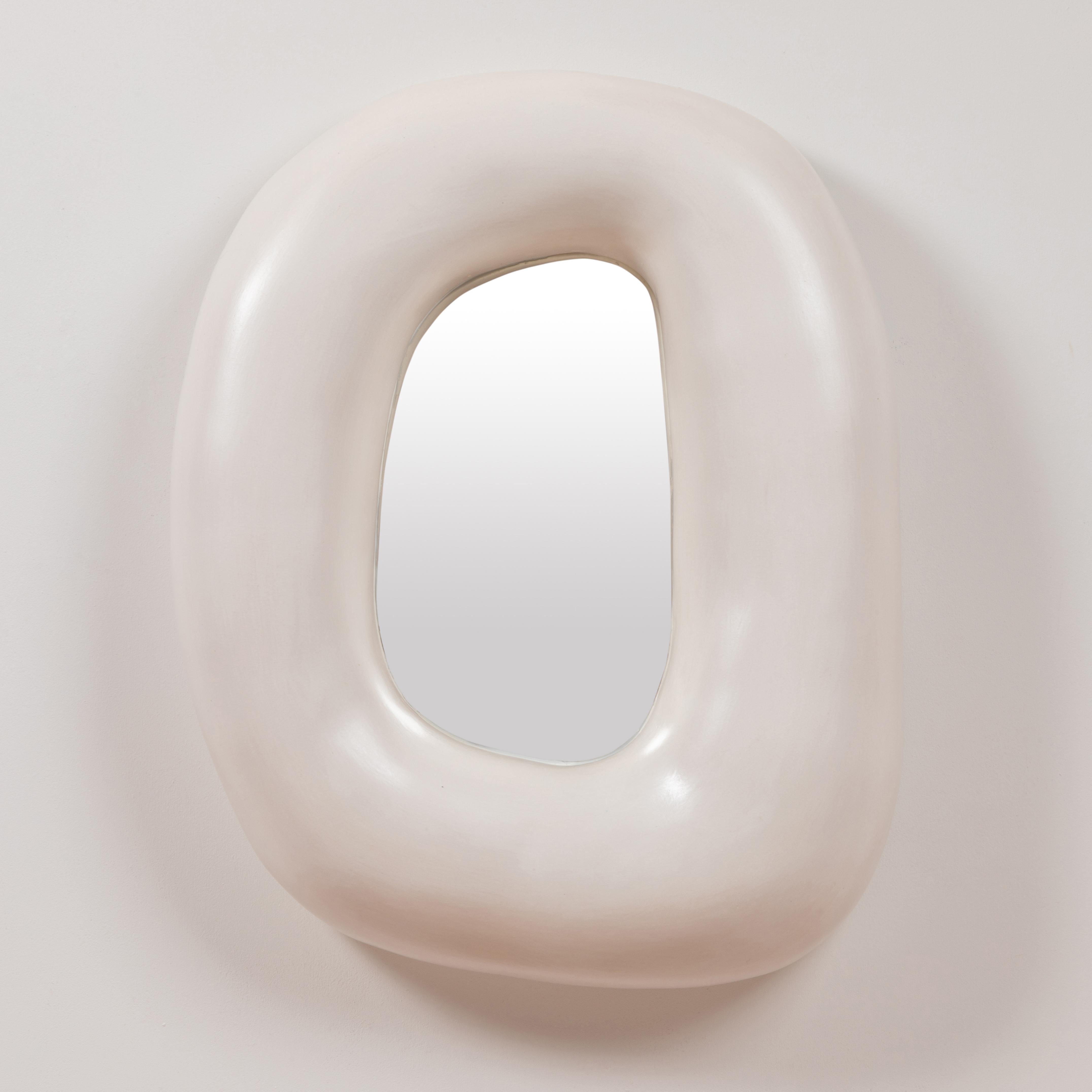 White mirror by Elsa Foulon
Dimensions: D 50 x H 40 cm 
Materials: Ceramic, mirror
Unique piece

Elsa Foulon, before becoming a ceramist, was born the daughter of an antique dealer and then became a dealer in 20th century decorative arts. She