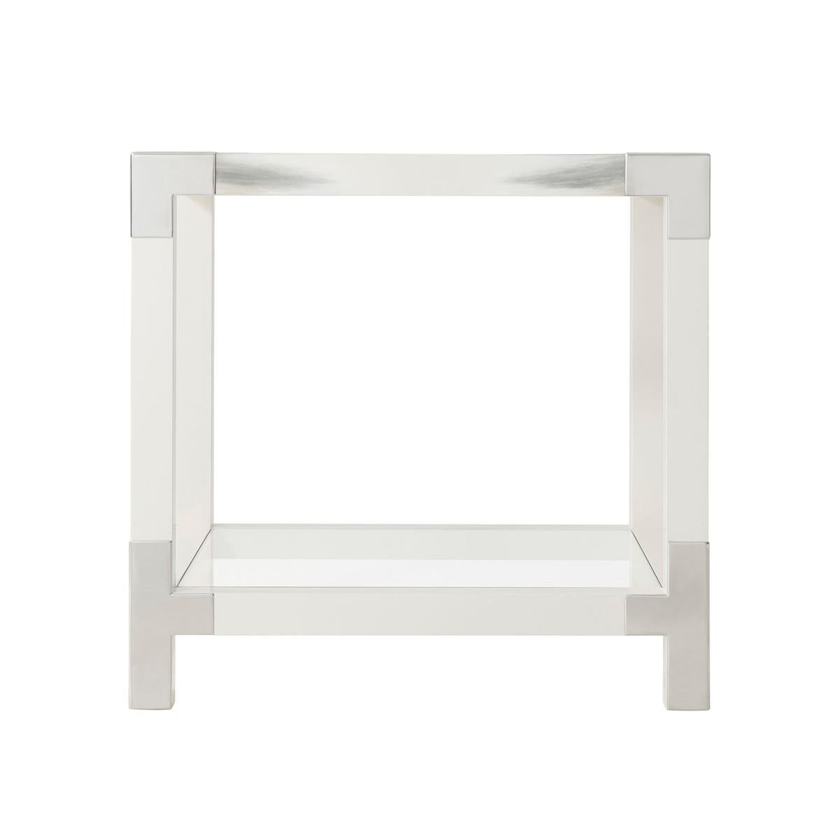 A white lacquered and faux horn painted accent table, the square glass inset top with stainless steel edged corners, on square legs joined by stretchers and an inset glass under tier.

Dimensions: 25