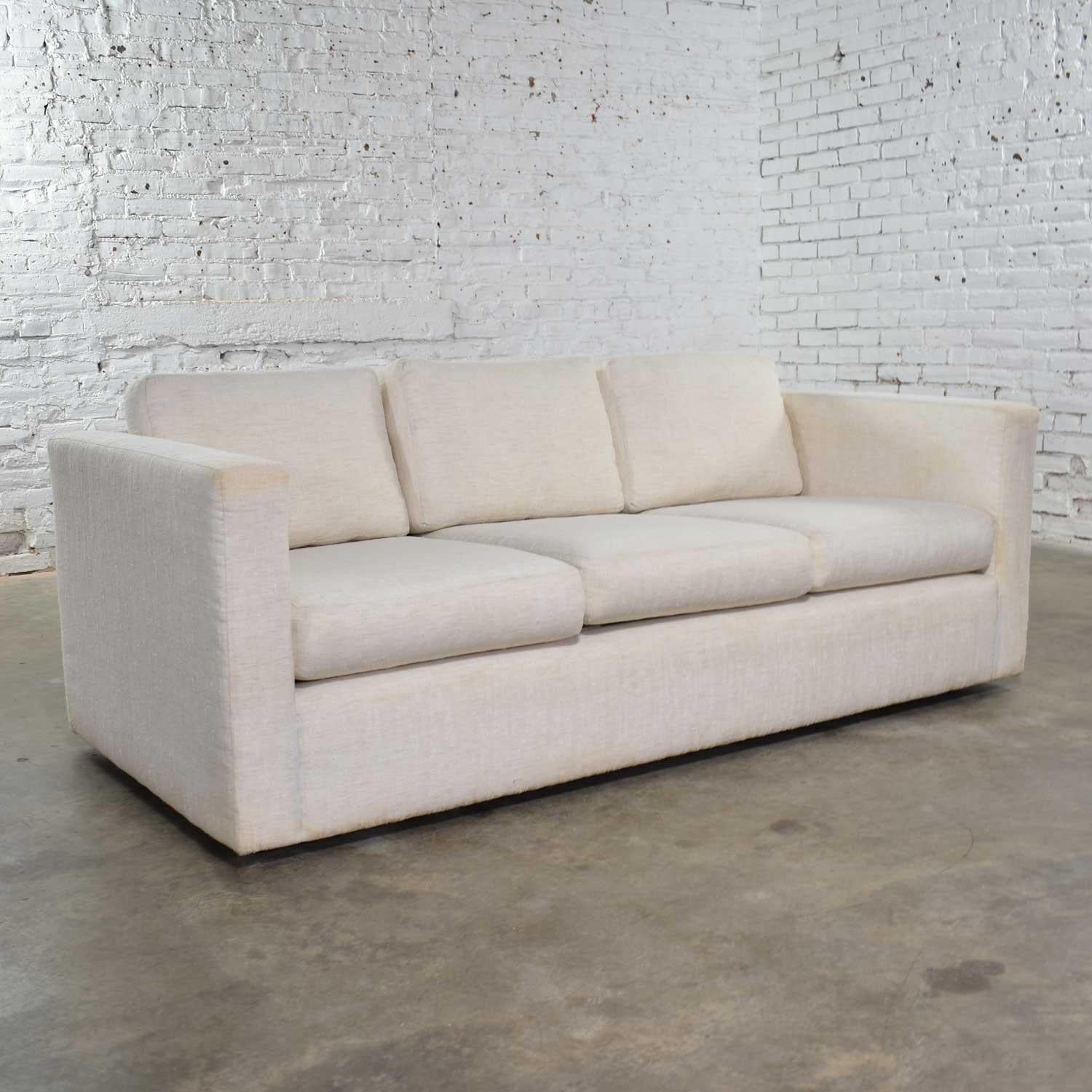 Handsome modern tuxedo style sofa designed by Milo Baughman for Thayer Coggin. This is from an unspecified collection from the 1980s. It is in good vintage condition. The structure is solid but even though we have had it professionally cleaned it