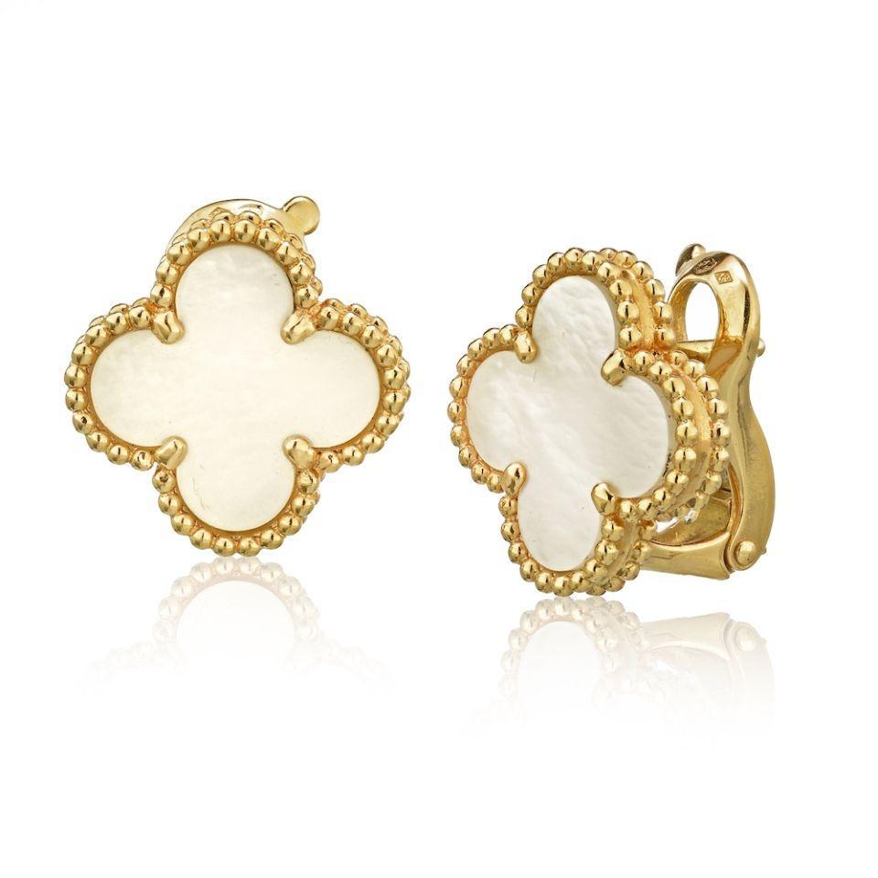 A single clover motif adorns Van Cleef & Arpels' Vintage Alhambra Earrings! White mother of pearl is edged in a double row of 18K yellow gold beading in these pierced earbobs with hallmarked omega-clip backings. They are in excellent condition and