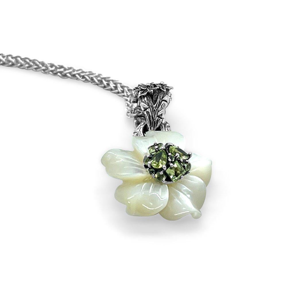 White Mother of Pearl Flower with Peridot Gemstone Center with Large Engraved Sterling Silver Toggle

The everblooming flower that is captured forever in this collection, is timeless and should be worn in all seasons. White mother-of-pearl glows as