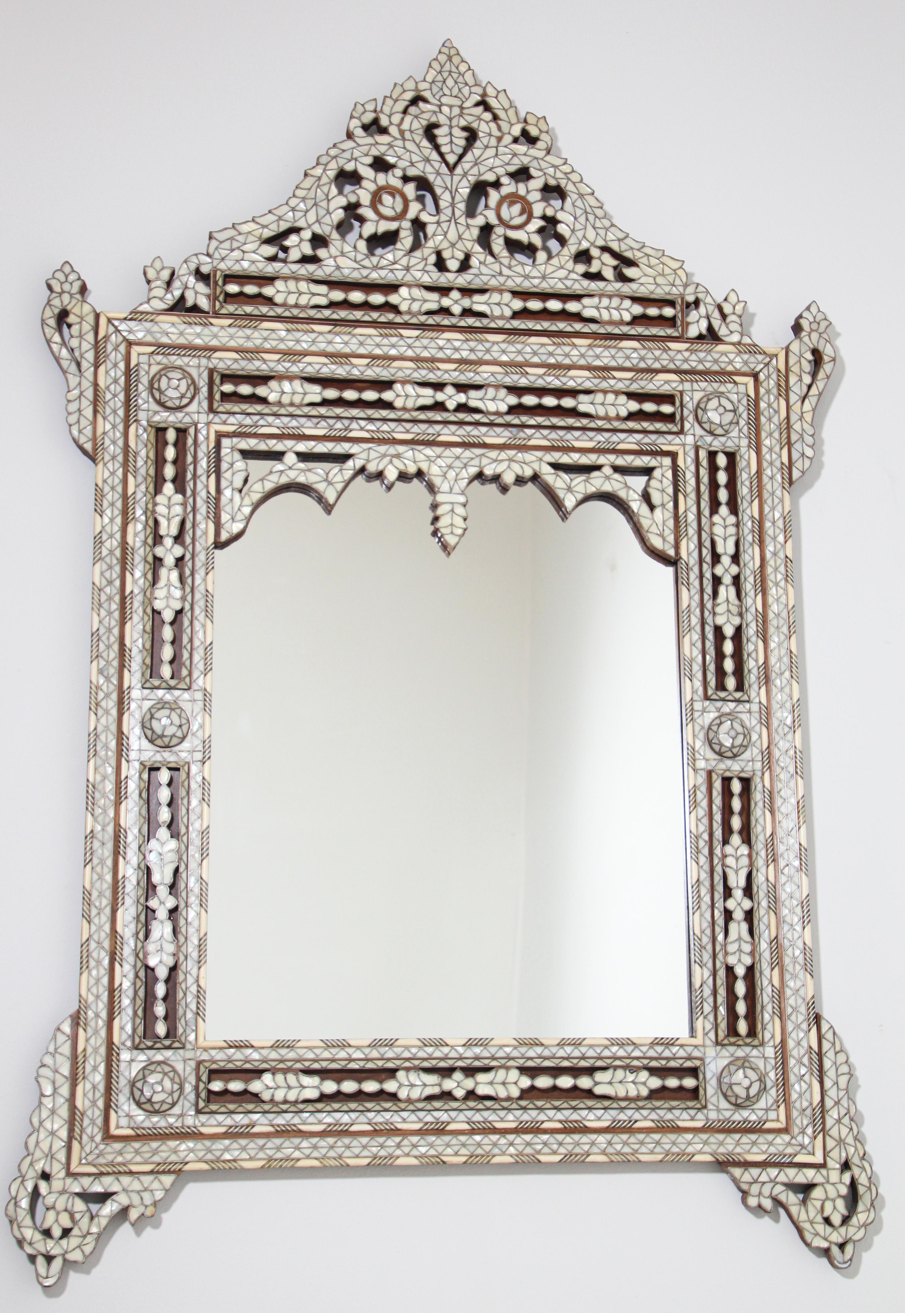 Lebanese Middle Eastern Moorish white mother of pearl inlaid mirror.
Antique Middle Eastern Moorish mirror in the Lebanese, Syrian style.
Sensational large Levantine finely inlaid with mother of pearl, each piece of mother of pearl is out lined