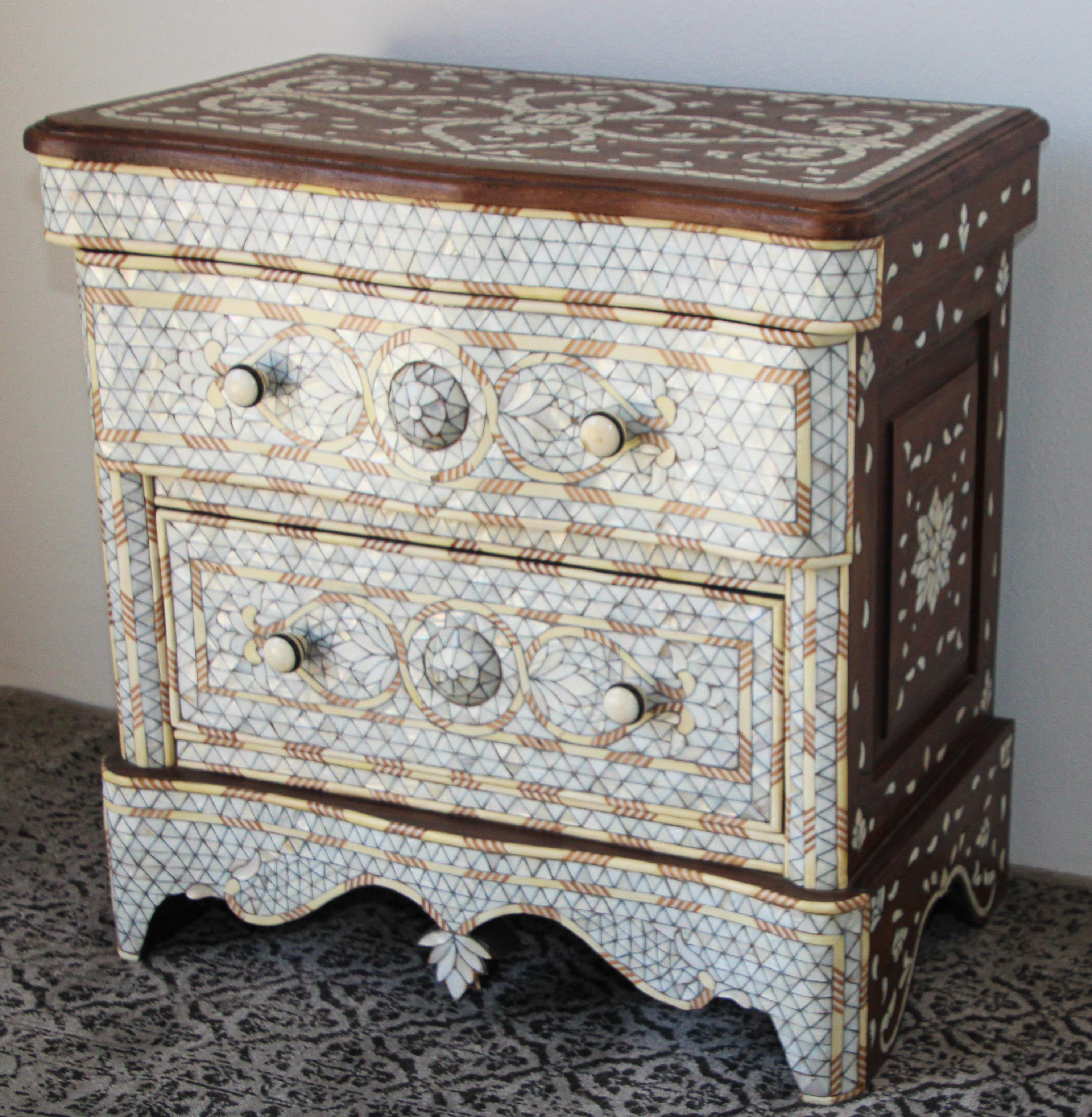 Fabulous Middle Eastern Syrian style Moroccan nightstand.
Handcrafted contemporary Moroccan dresser with two drawers, wood inlay with white mother of pearl.
Moorish arches and intricate Islamic designs.
Dowry chest of drawers heavily inlaid in