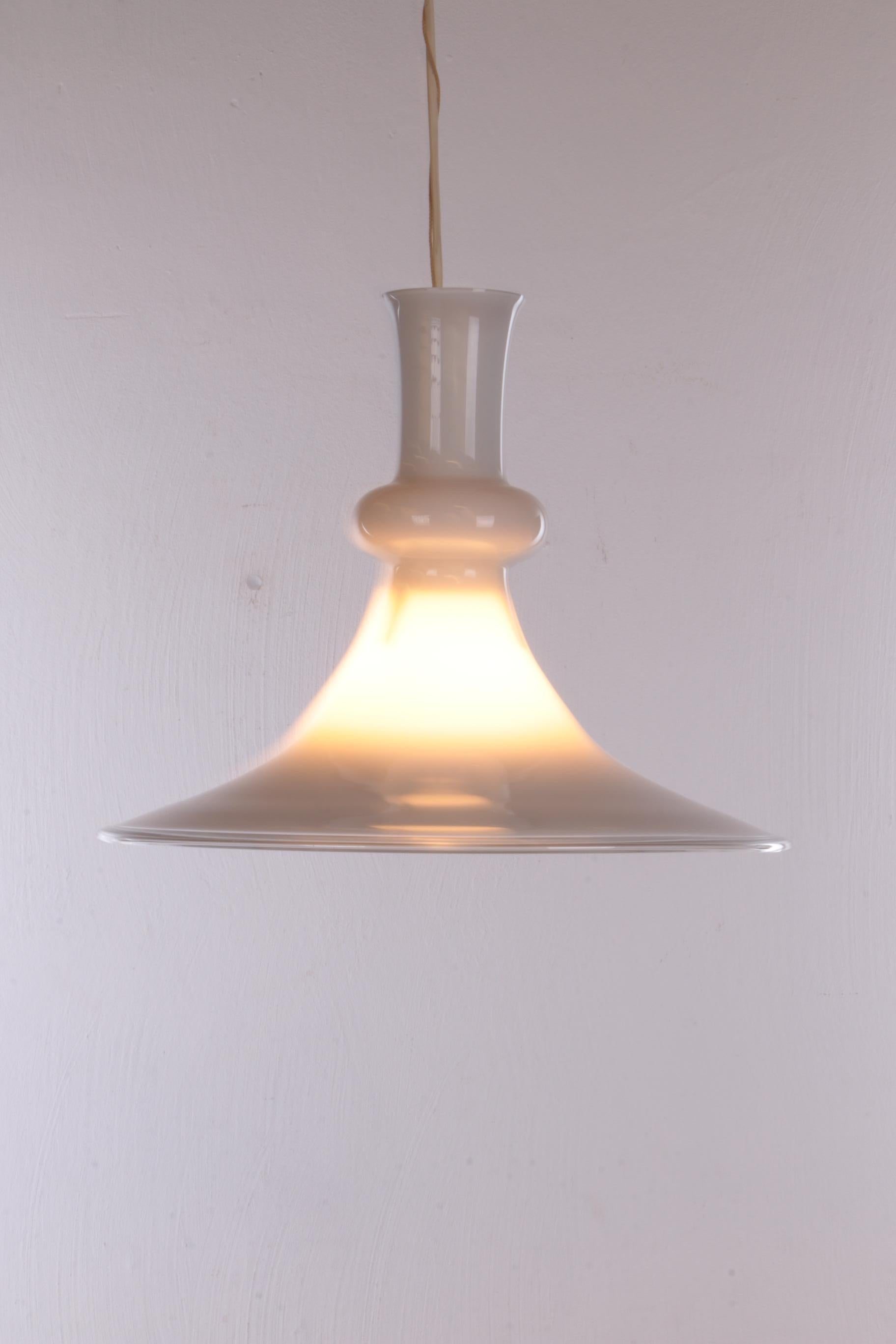 White mouth-blown opaline glass pendant by Michael Bang for Holmegaard, Denmark, 1980s

A rare modernist ceiling lamp in a simple, elegant shape - produced by Holmegaard/Royal Copenhagen GLASSWORKS, Origin: Denmark Time: