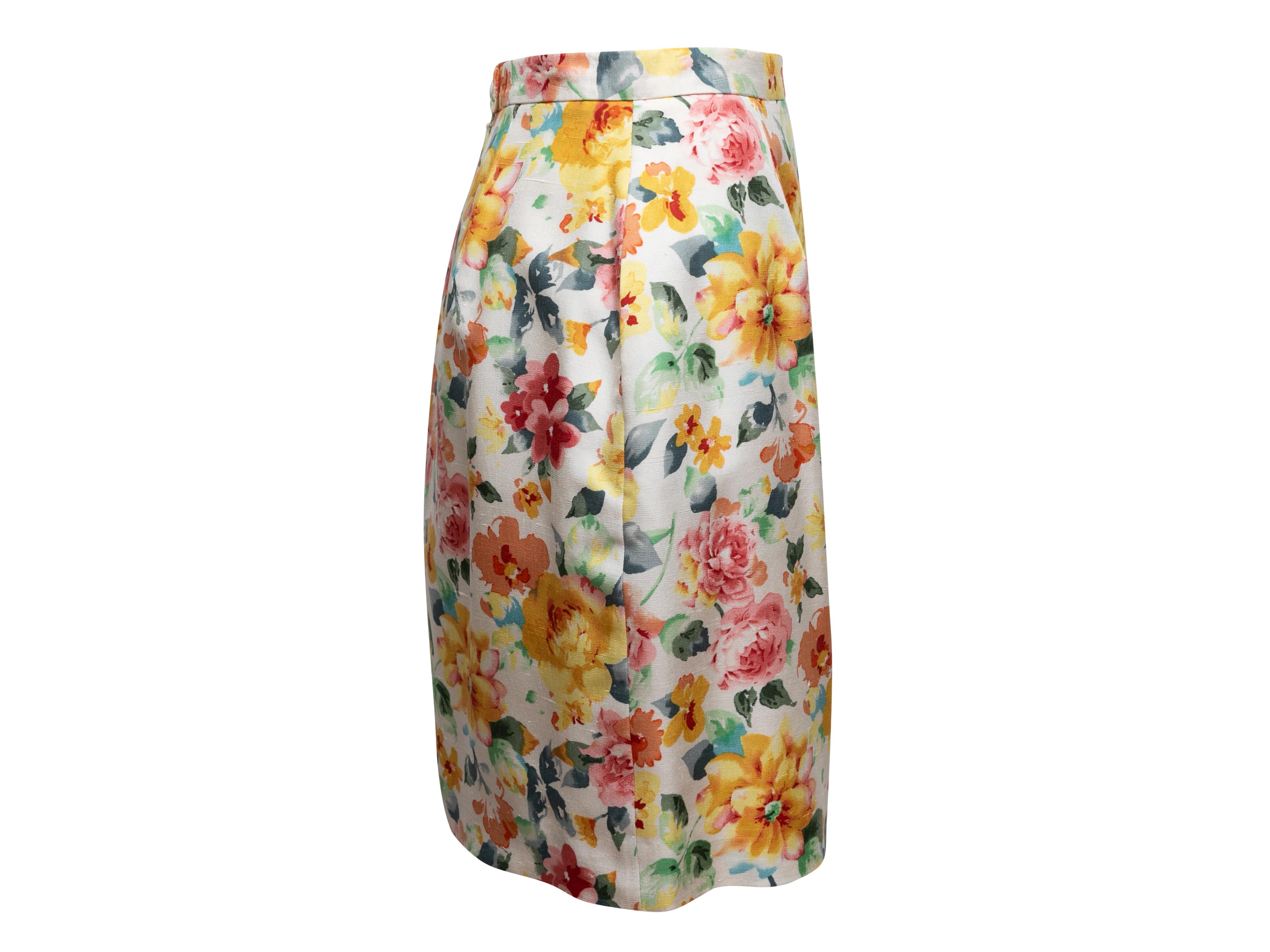 White and multicolor floral print pencil skirt by Christian Dior. Zip and button closures at back. 27