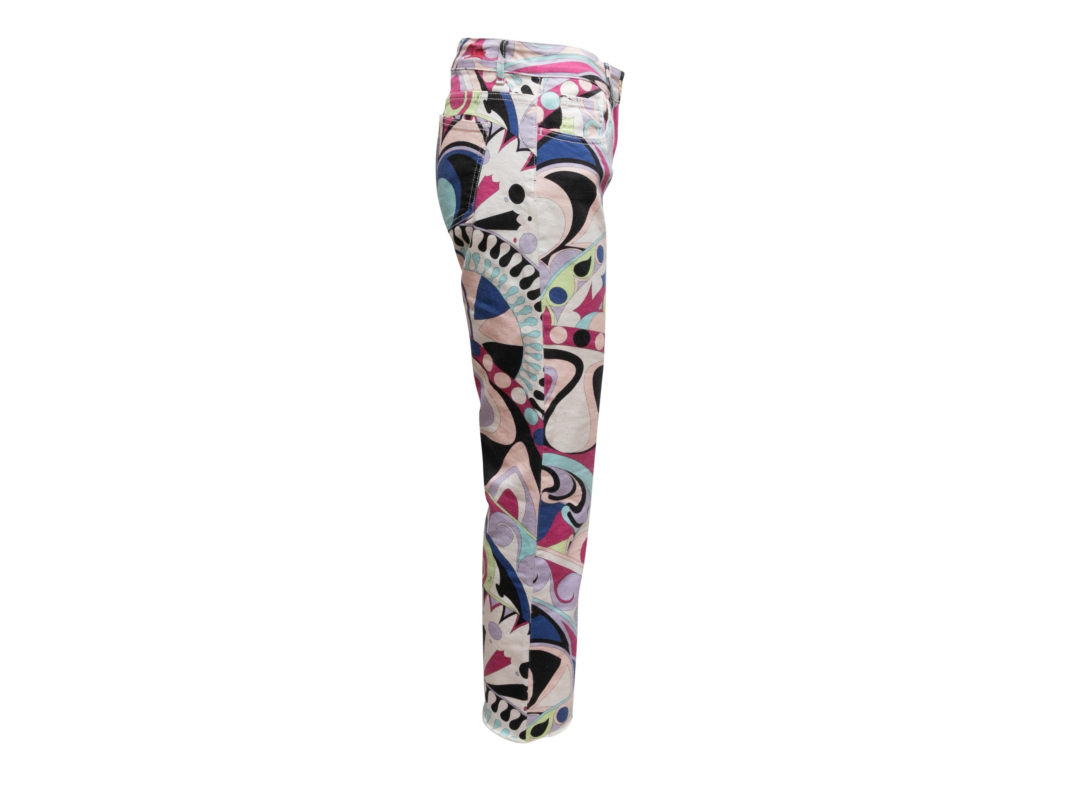 White and multicolor abstract print jeans by Emilio Pucci. Five pockets. Zip and button closures at front. 30