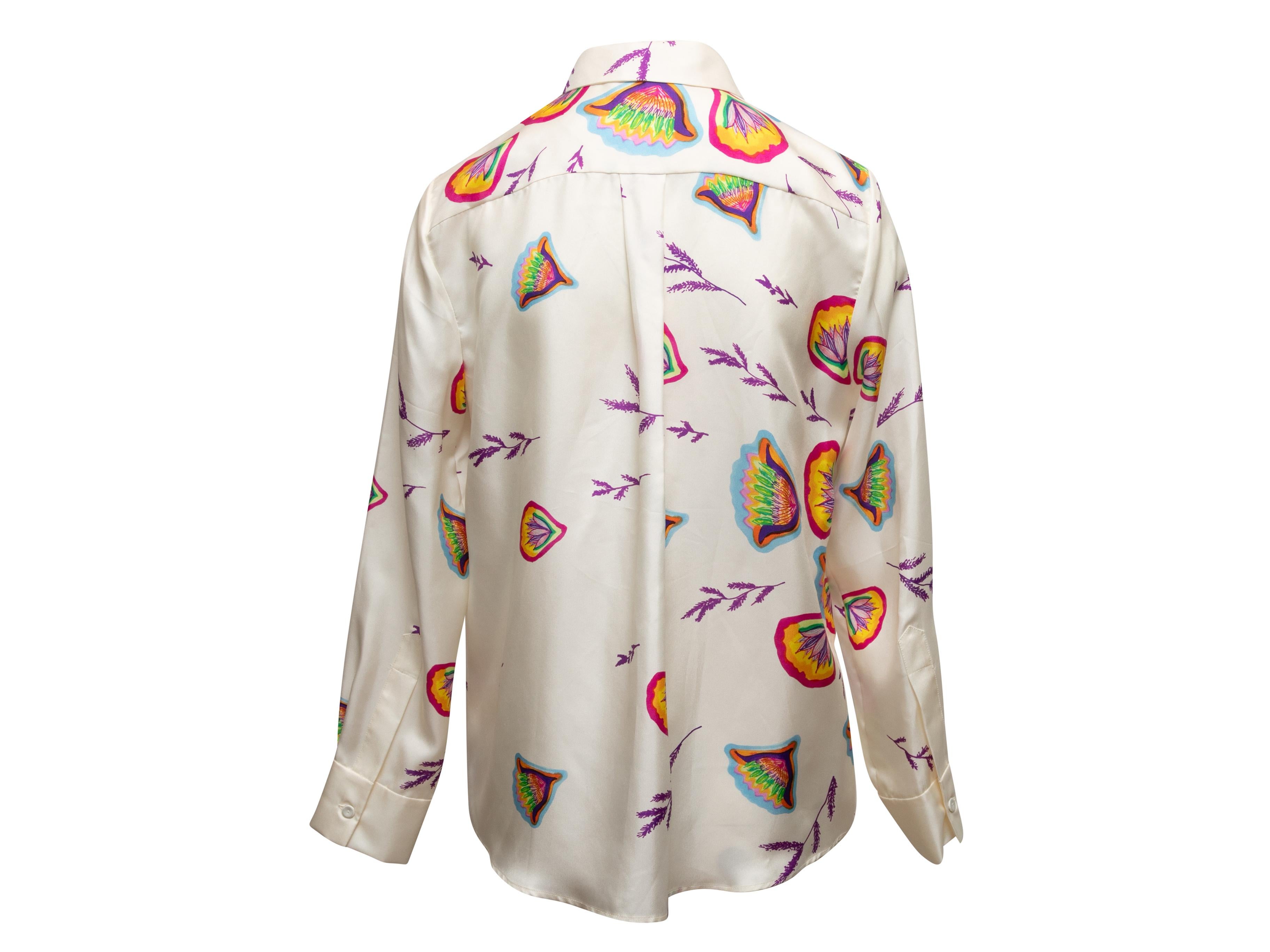 White and multicolor silk floral print long sleeve button-up top by Gabriela Hearst. Pointed collar. Button closures at front. Designer size 42. 34