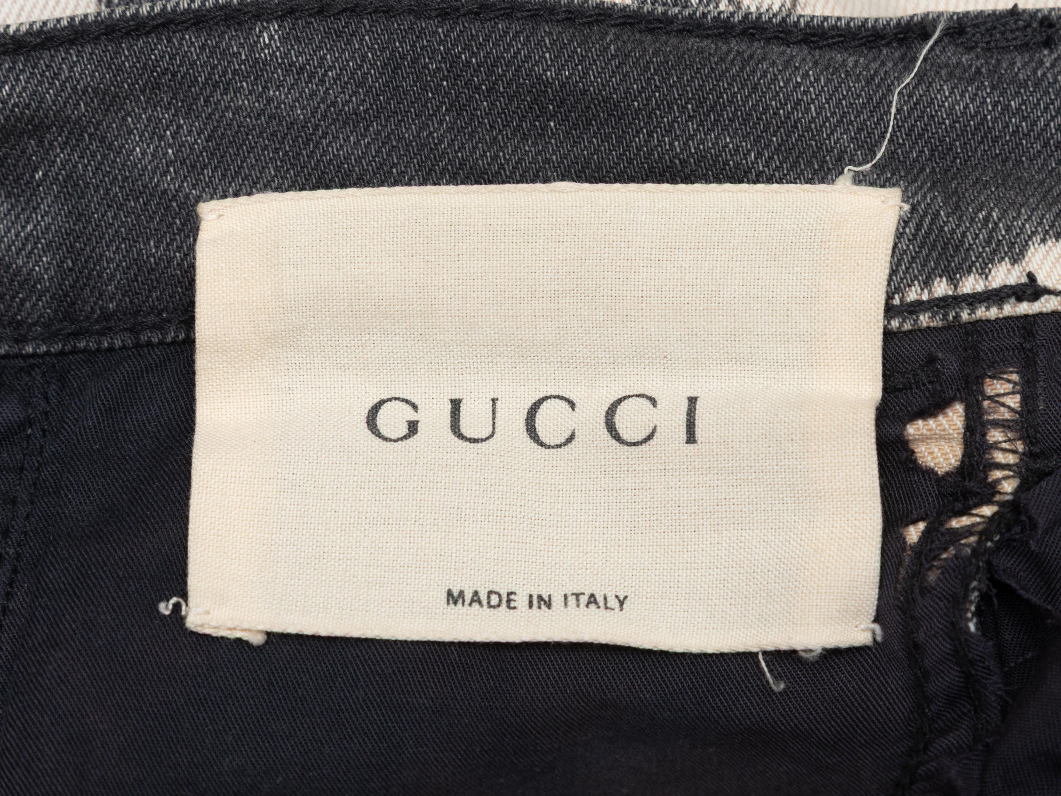 Vaqueros pitillo con acento de parche blanqueado blanco y multicolor de Gucci. Cinco bolsillos. Cierre con cremallera y botón delante. Cintura de 27,5