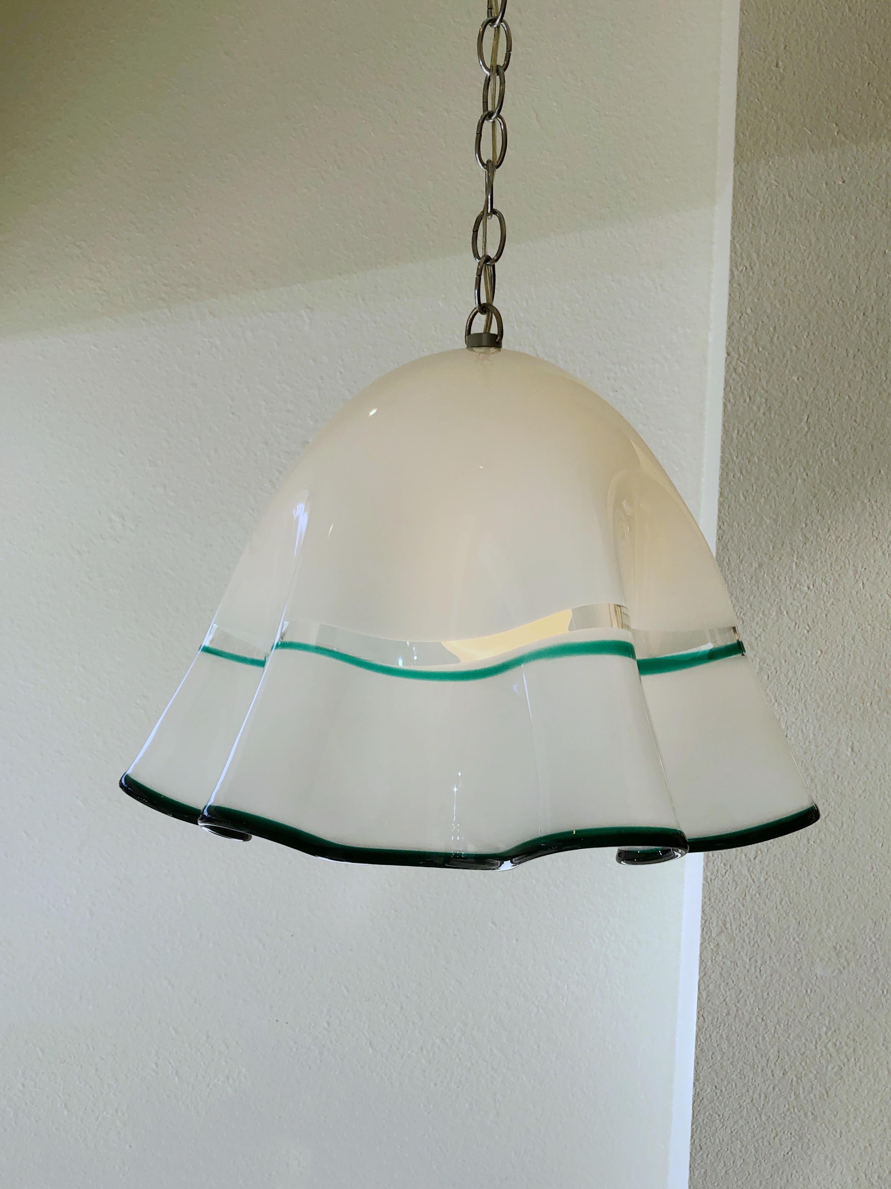 A 1960s Italian white with forest green outline Murano glass and chrome chain “Fazzoletto” by Mazzega. Newly rewired. We can add more chain if need.
Dimensions: 19” diameter, 15” high, 48” high with chain.