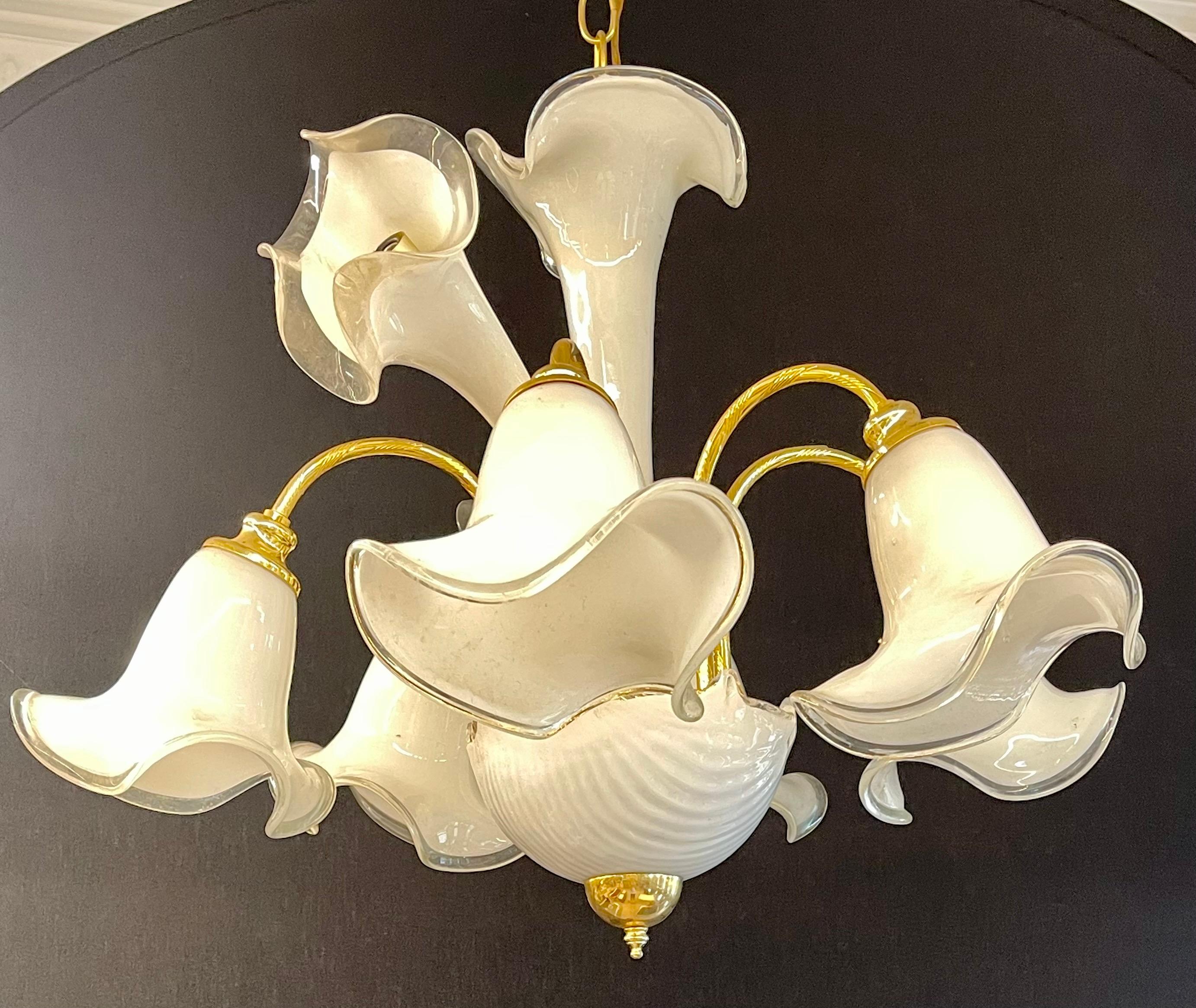 White murano glass chandelier having 9 lights in the tulip form.