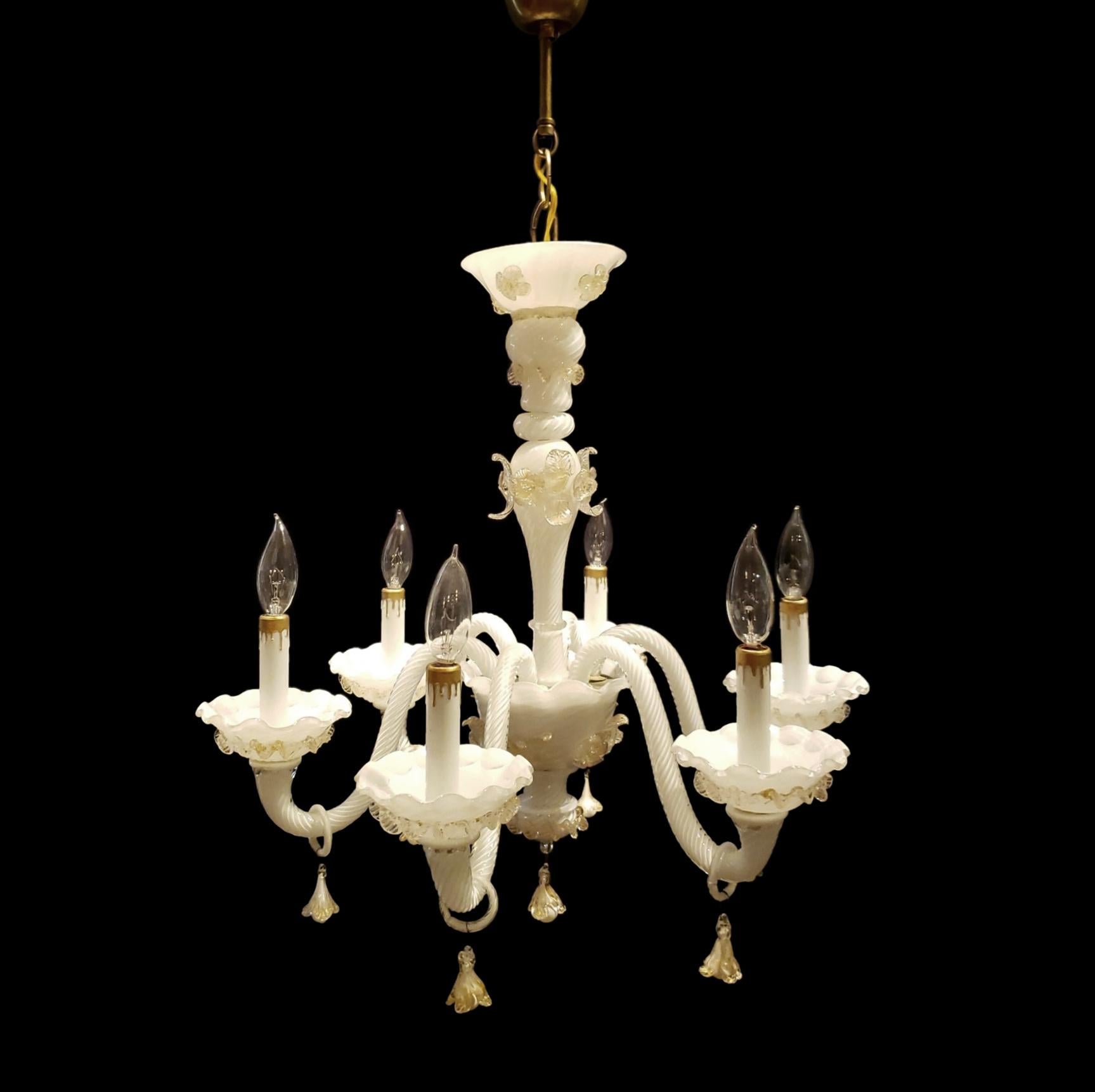 This 20th Century Murano glass chandelier with white with gold accents features 6 S shaped arms. This comes rewired and ready to install. Ships disassembled. Cleaned and restored. Please note, this item is located in our Scranton, PA location.