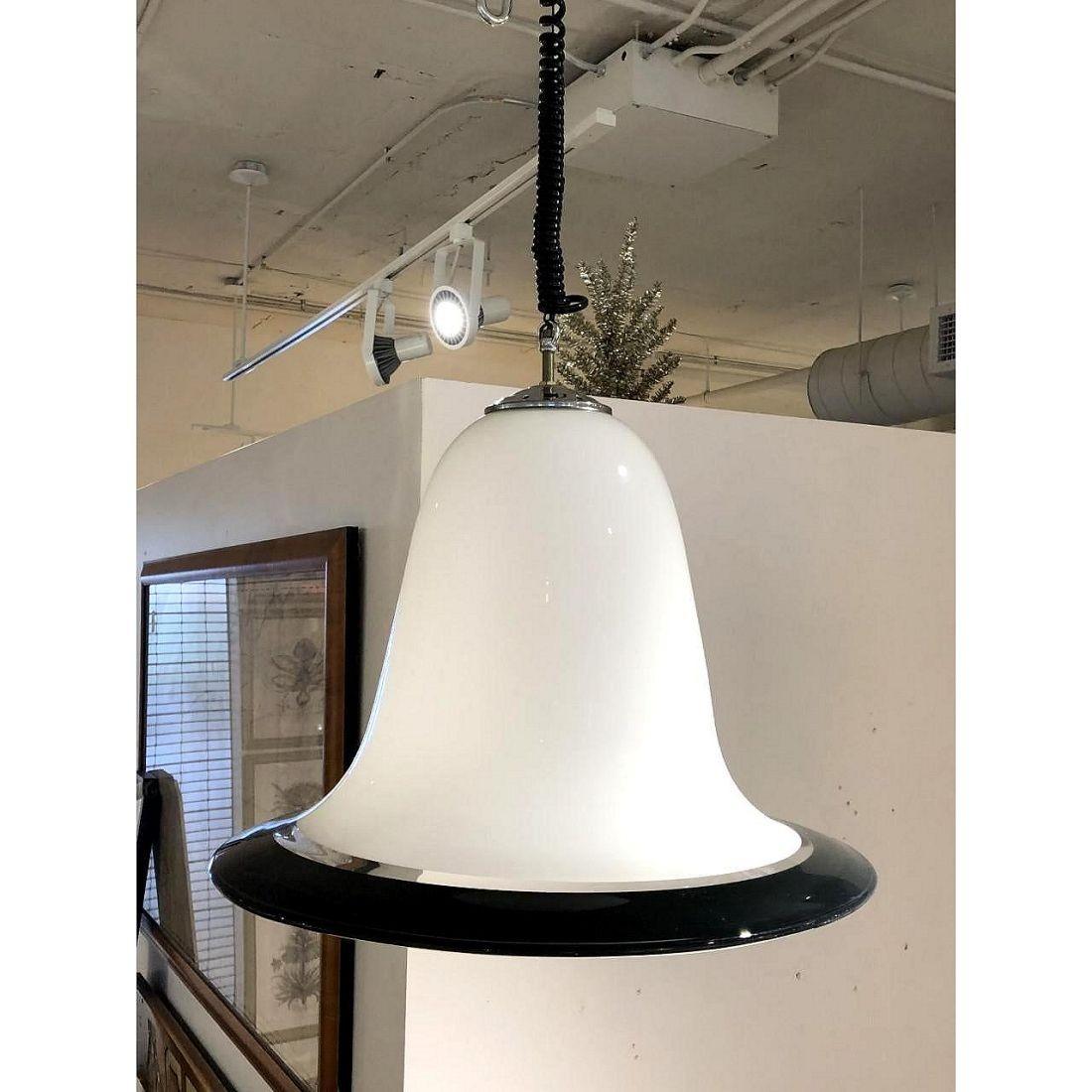 Mid-Century Modern bell shade pendant chandelier by Seguso Italy 1960s.
The Murano ceiling light is white, translucent with black accent.
The chandelier has chrome fitting on top of the Murano glass bell shade.
Black spiral cording attaches to