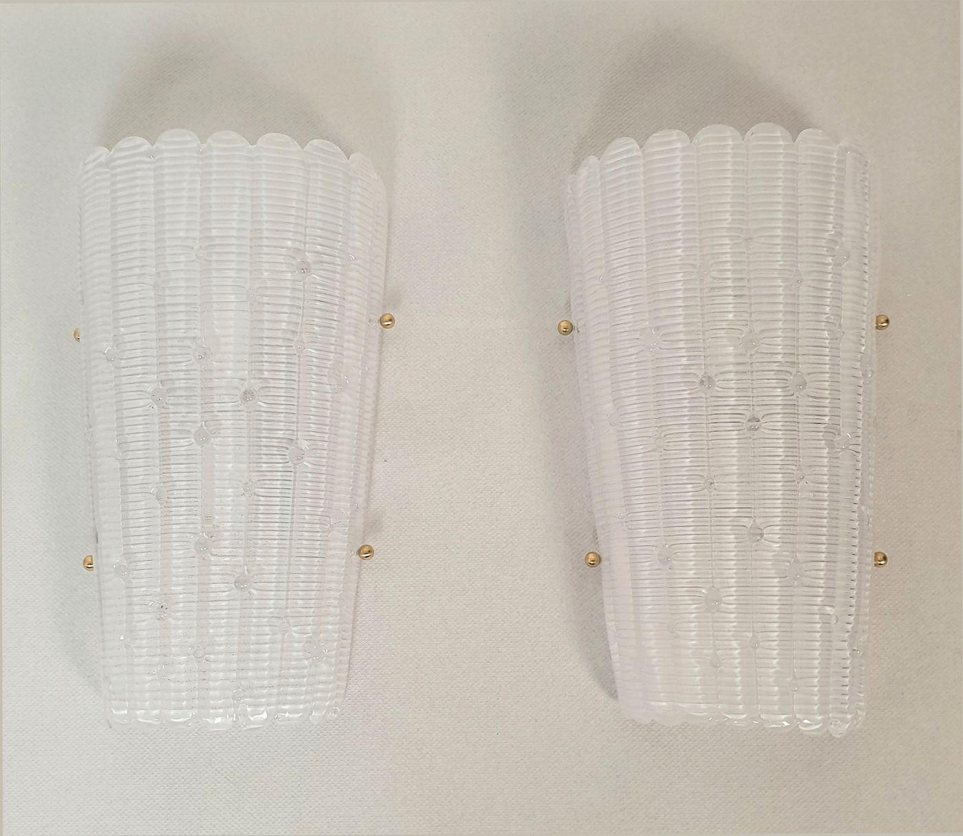Pair of large Mid Century Modern Murano glass wall sconces, attributed to Mazzega, Italy 1980s.
We have two pairs available - or a set of four sconces.
Sold and priced by pair.
To inquire about the set of four sconces, select 2 items in the