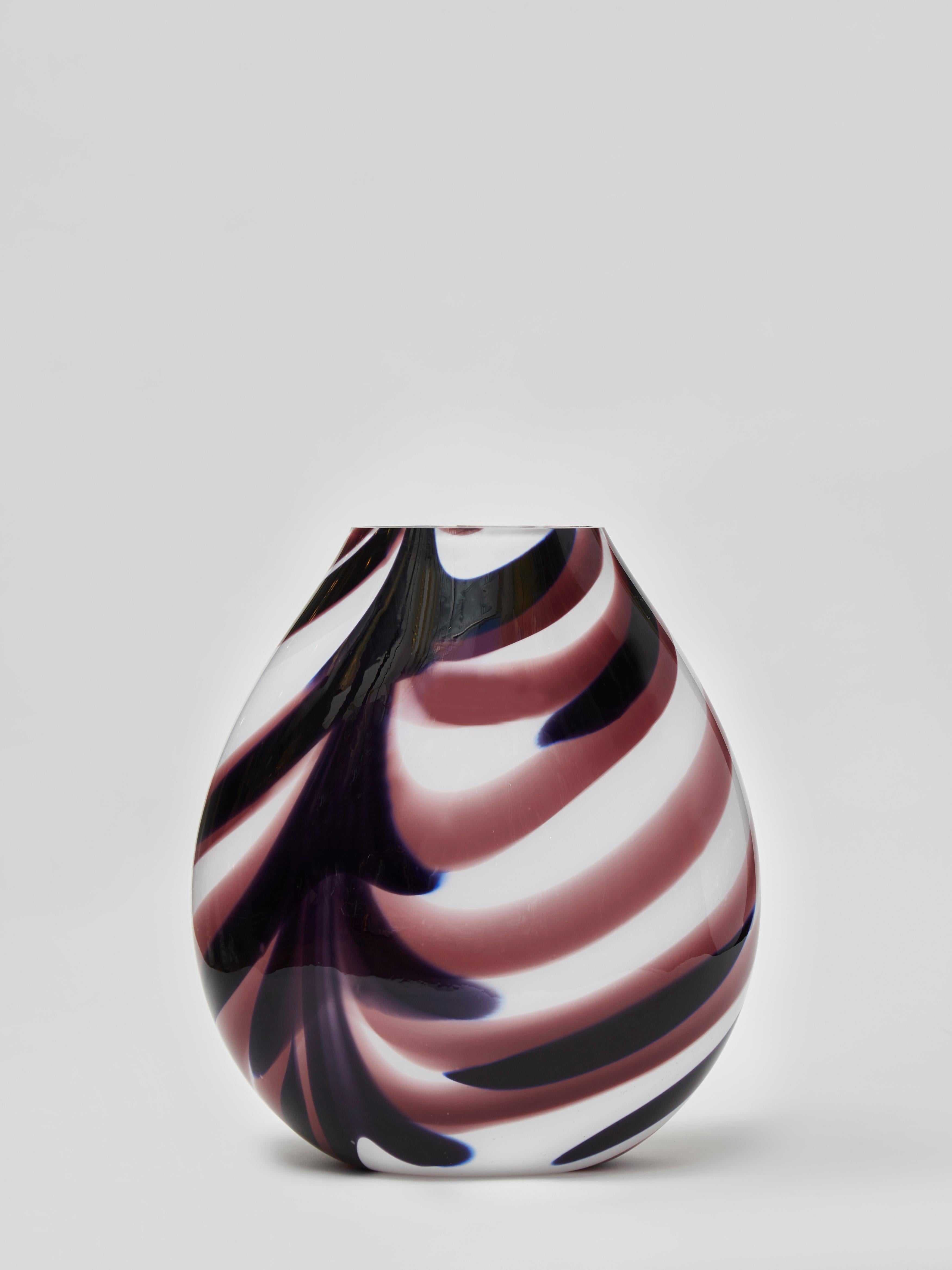 White tear drop shaped Murano glass vase with abstract purple streaks.