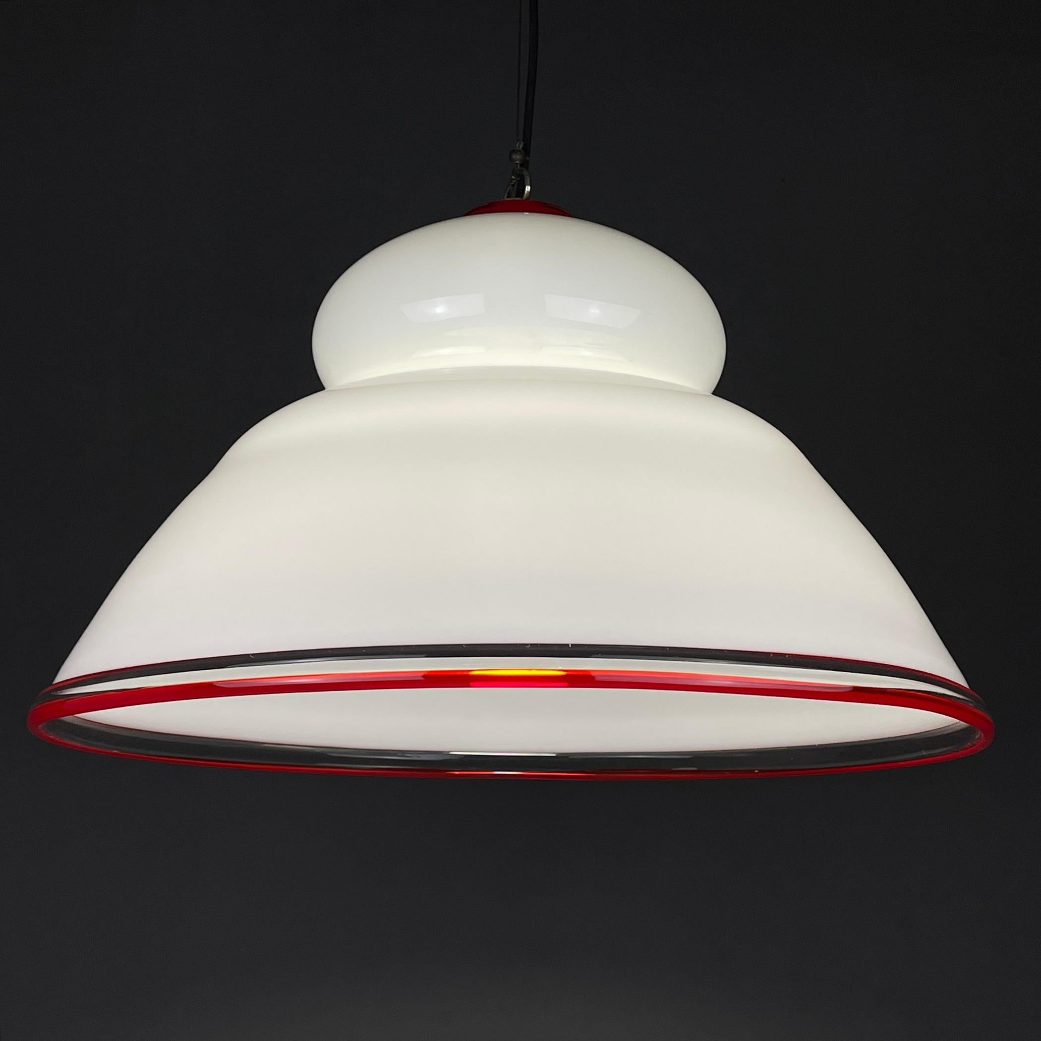 Italian 1970s midcentury white and red Murano glass pendant lamp.

This Murano glass chandelier is a famous example of Italian lighting from the 1970s. It is fashionable and elegant.
Italian made.

Amazing vintage condition.
No cracks or