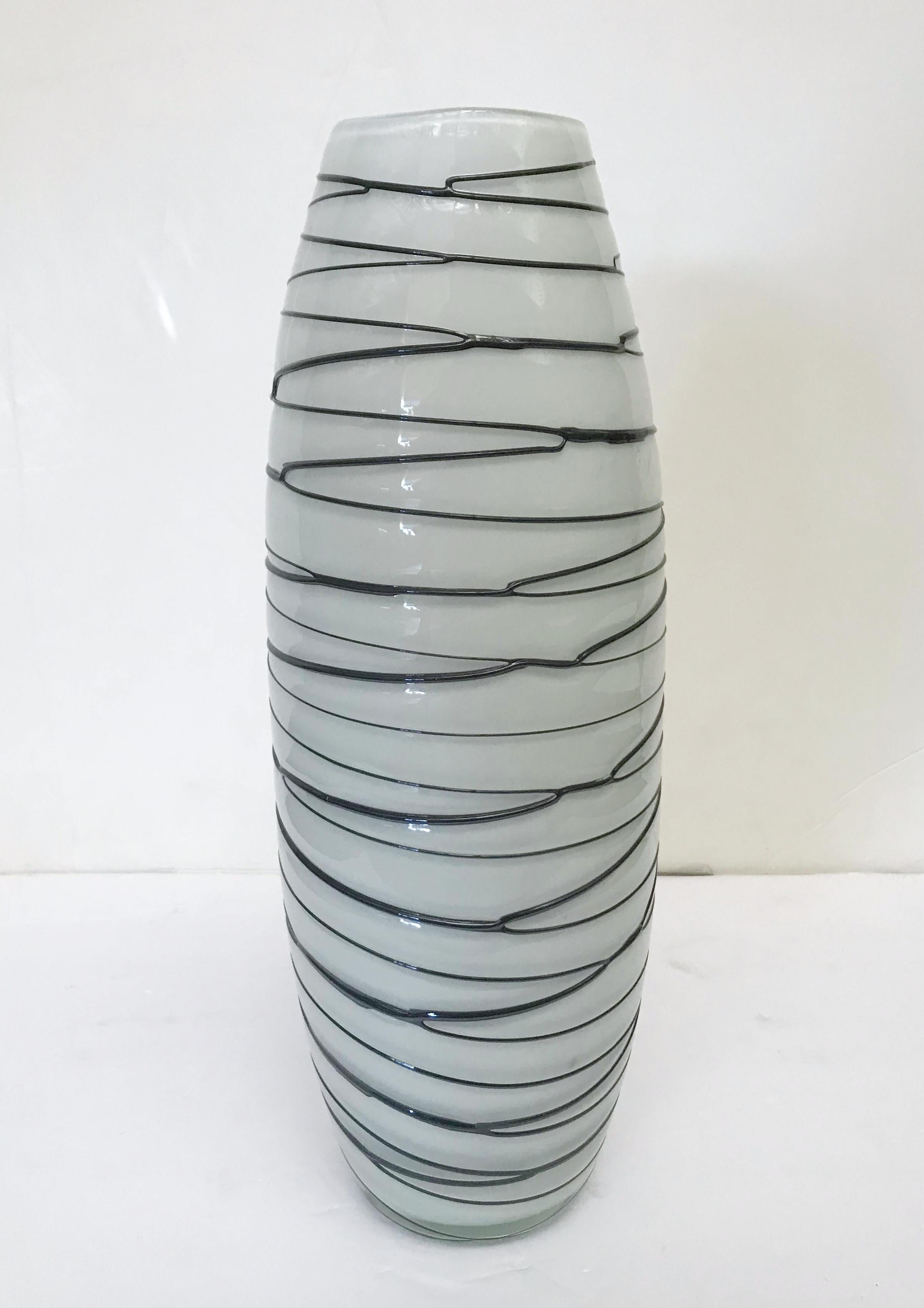 Italian white Murano glass vase with hand decorated black glass stripes / Made in Italy circa 1960s
Measures: Height 15 inches / diameter 5 inches
1 in stock in Palm Springs currently ON 40% OFF SALE for $749 !!
Order Reference #: FABIOLTD P64
This