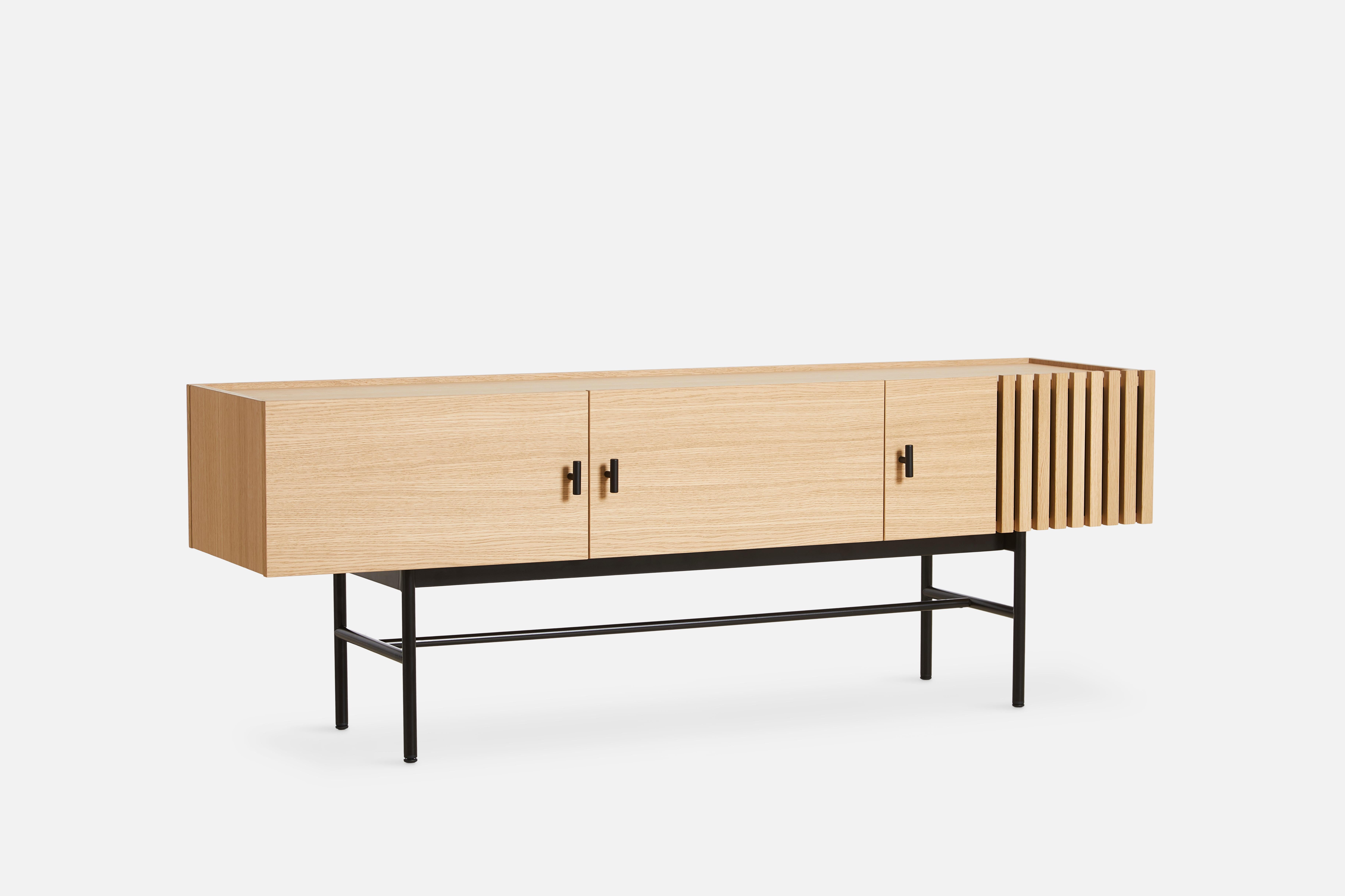 White Oak Array low sideboard 150 by Says Who
Materials: Oak, Metal
Dimensions: D 37 x W 150 x H 53 cm
Also available in different colors and materials. 

The founders, Mia and Torben Koed, decided to put their 30 years of experience into a new