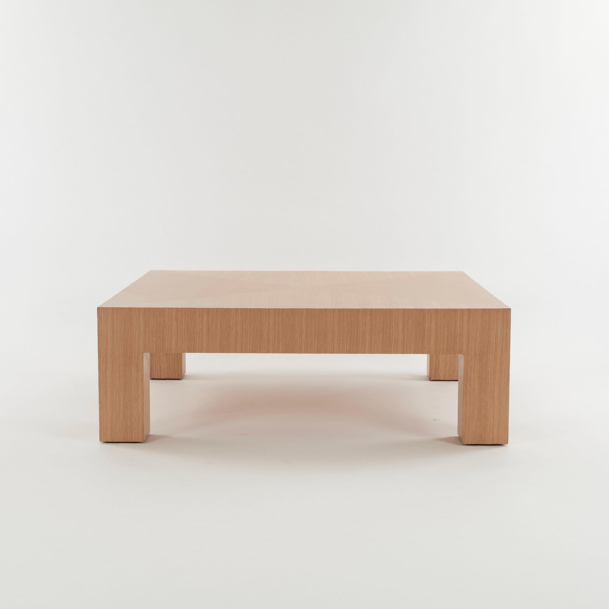 Large Parsons style wood cocktail table with single drawer and finished in natural white oak veneer. Also available in espresso or black.