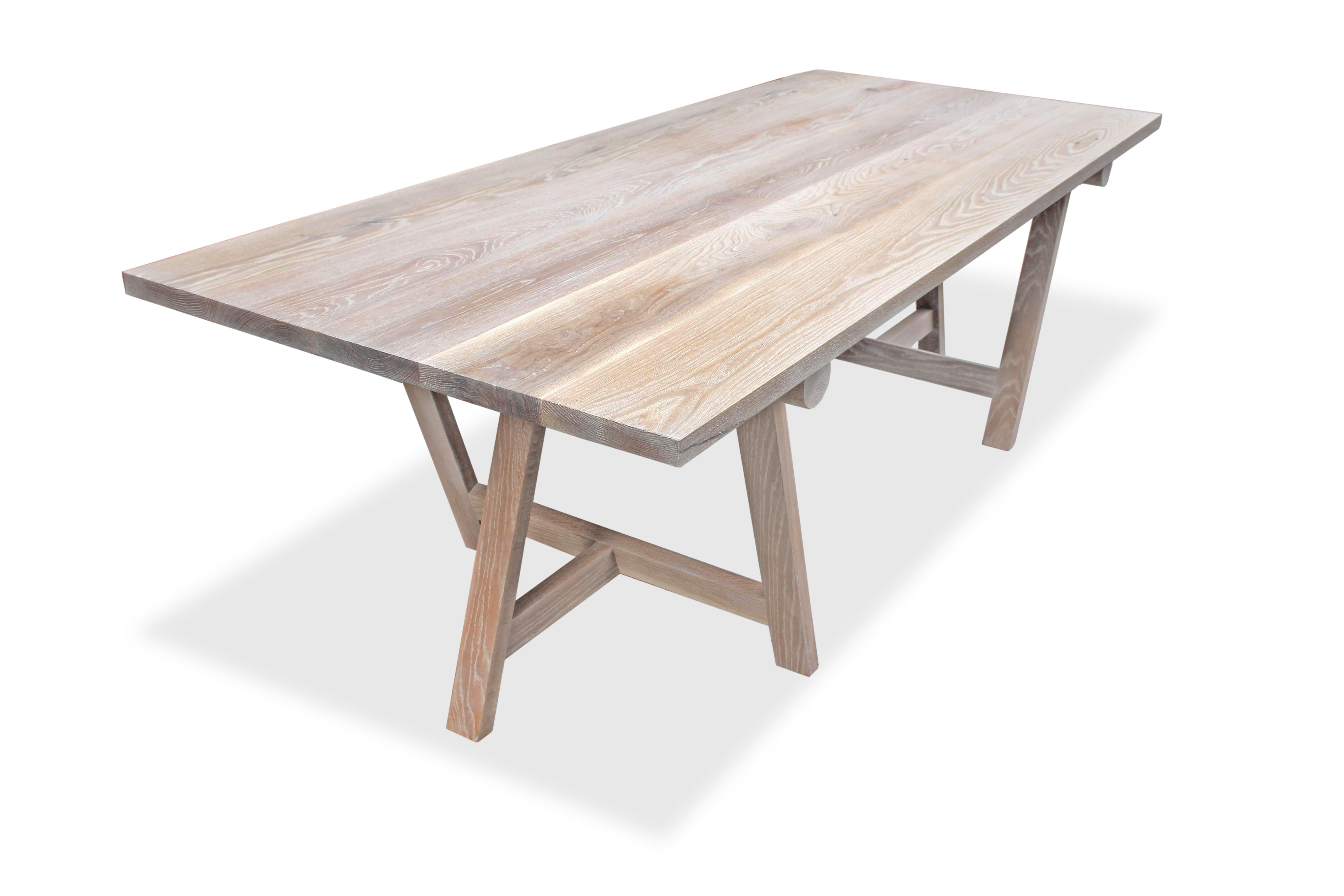 This white oak dining table conveys a graceful simplicity. Inspired by a recent trip to the island of St. Barths, this piece features clean lines and a gorgeous cerused finish.