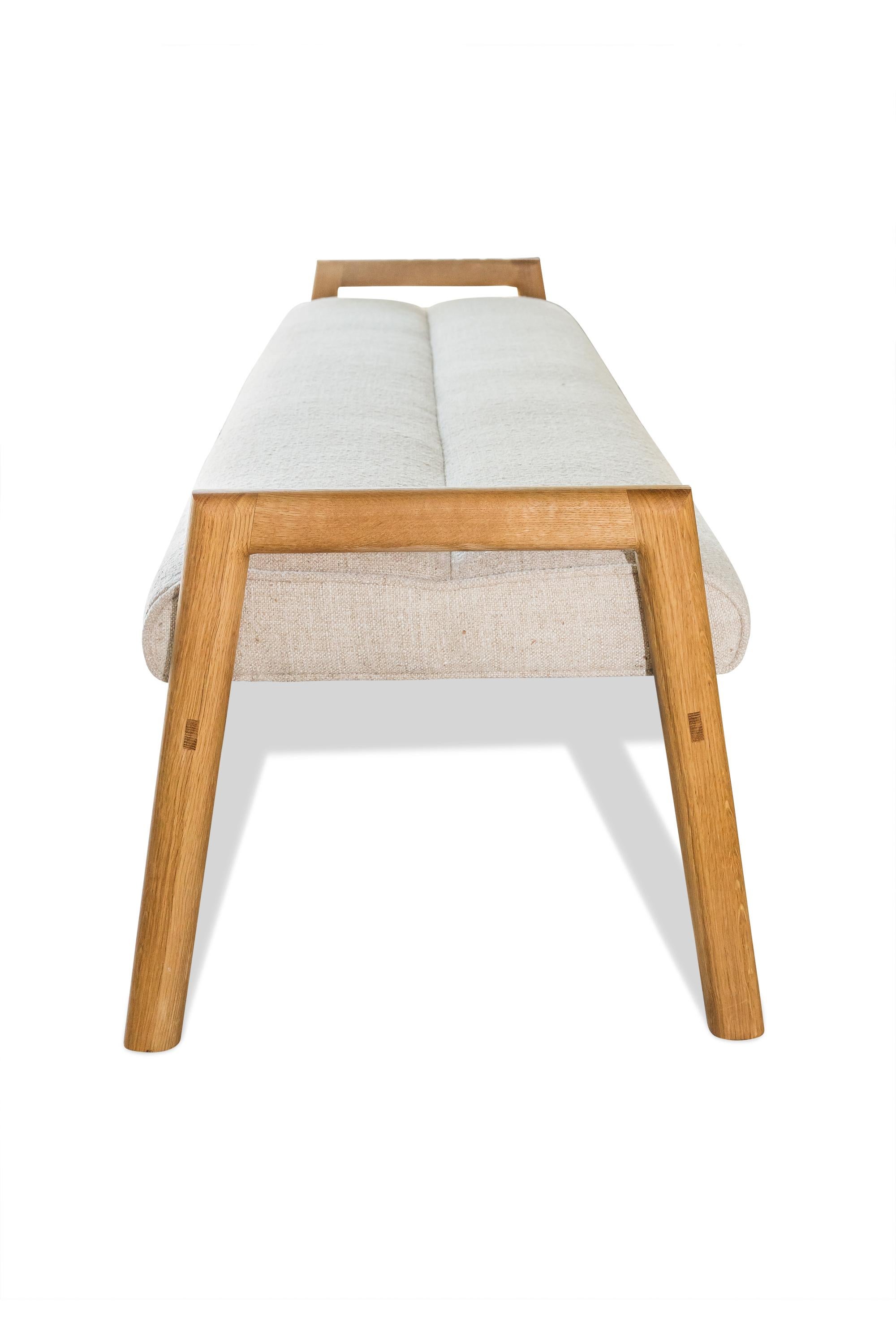 The seventh installment of the MORESBY collection, this bench is sure to be a conversation piece in any space. The MORESBY Bench is constructed of solid wood, with a plush cushion placed on top to add comfort to the sleek design. Both the wood and