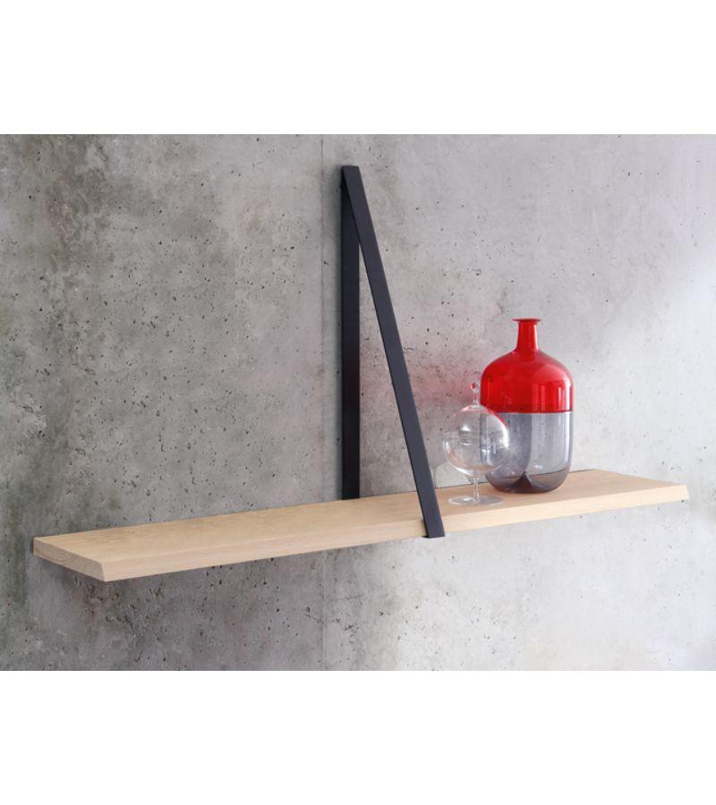 White Oak T-Square shelf by Michael Anastassiades
Materials: Top in natural solid oak painted or black varnished. Triangular tray support in black nickel-plated bronze or polished solid brass.
Technique: Lacquered wood or polished brass.