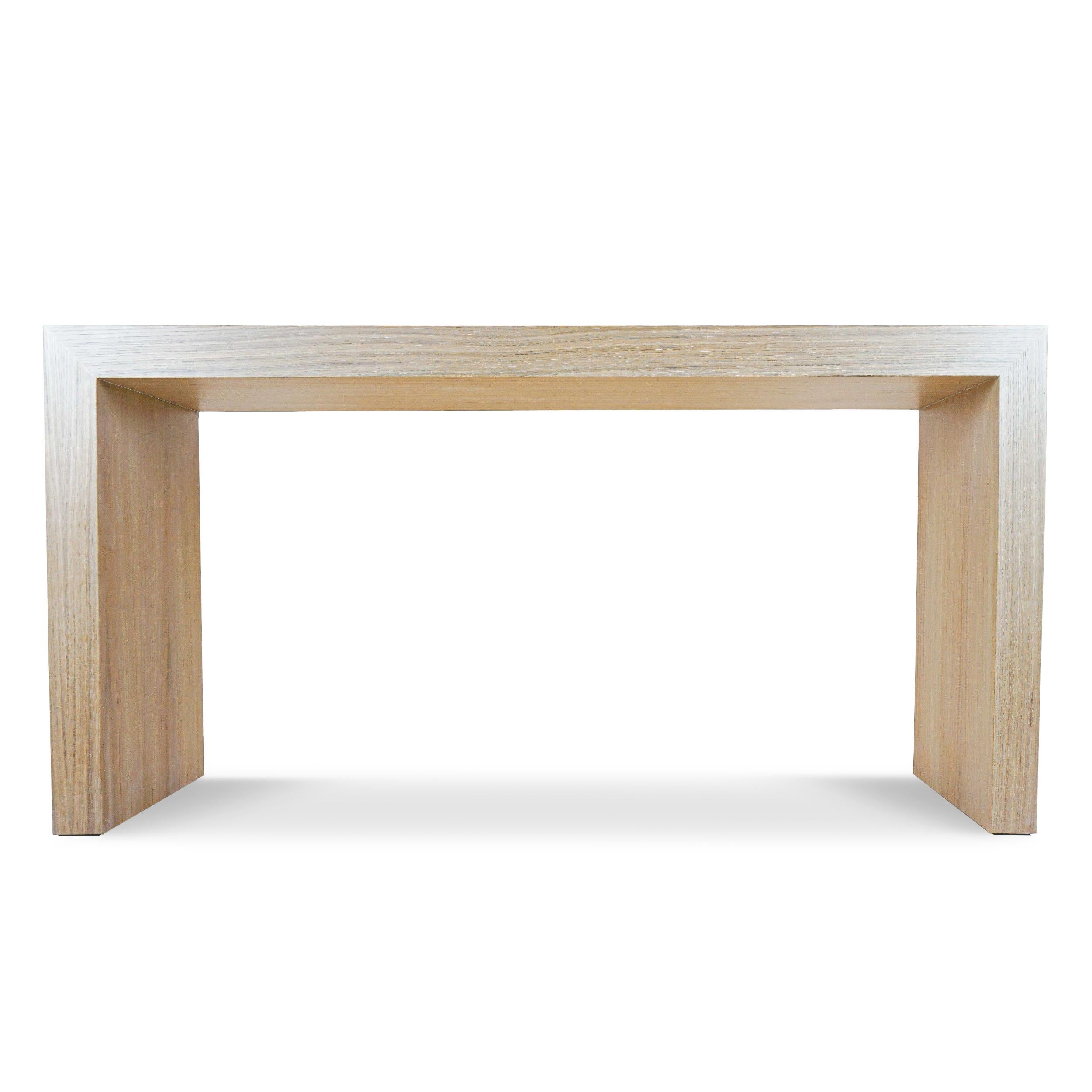 Waterfall console with white oak veneer finished clear. Easy to customize in size and stain color. Made by hand in Connecticut.

Measurements:
Overall: 60”W x 16”D x 30.5”H
Thickness: 3