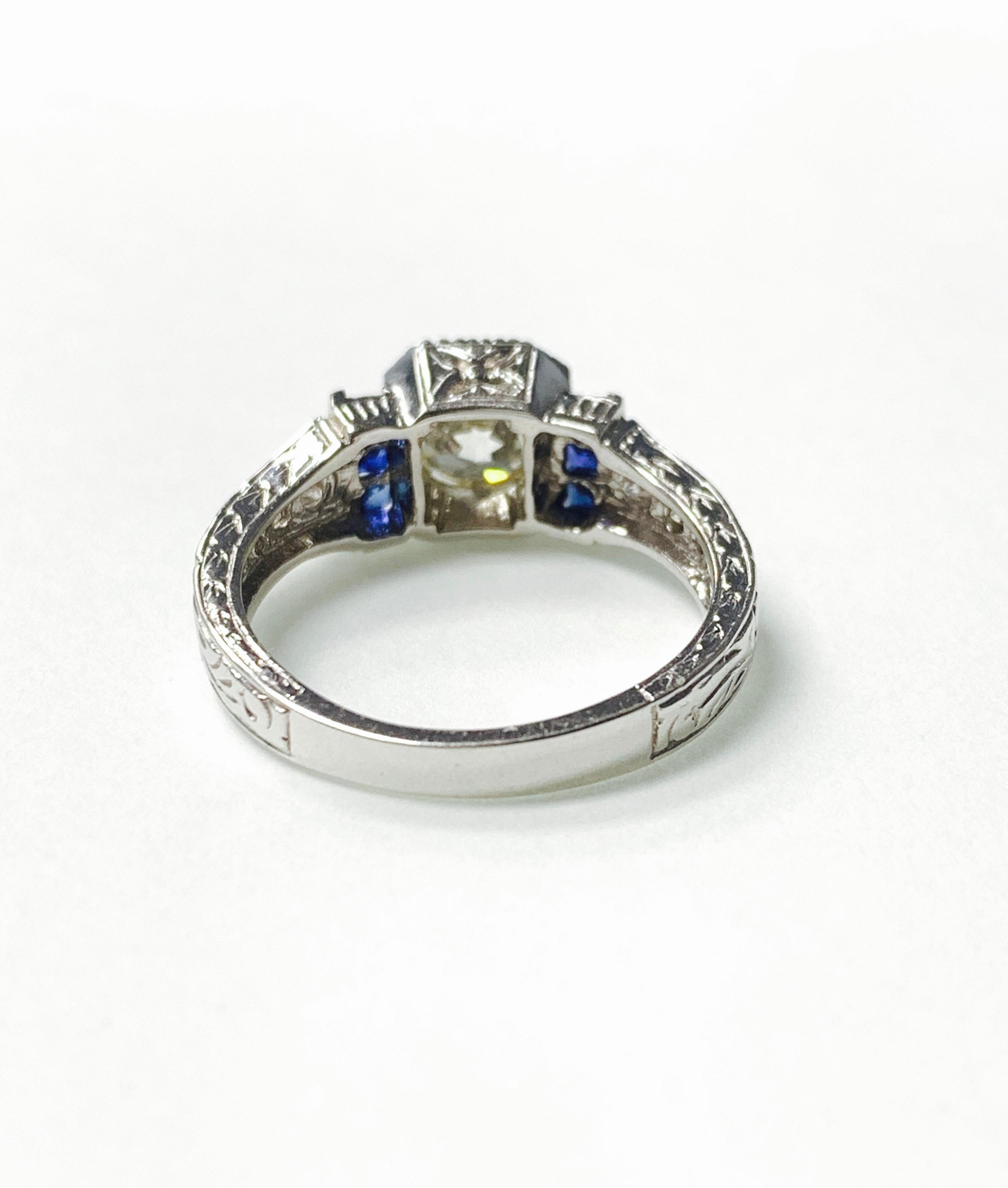 Beautifully handcrafted white old european cut diamond and blue sapphire ring. 
The details are as follows : 
Diamond weight : 1.05 carat ( K VS2 ) 
Diamond weight : 0.20 carat ( small diamonds )
Blue sapphire : 0.22 carat 
Metal : 18K Gold 
Ring