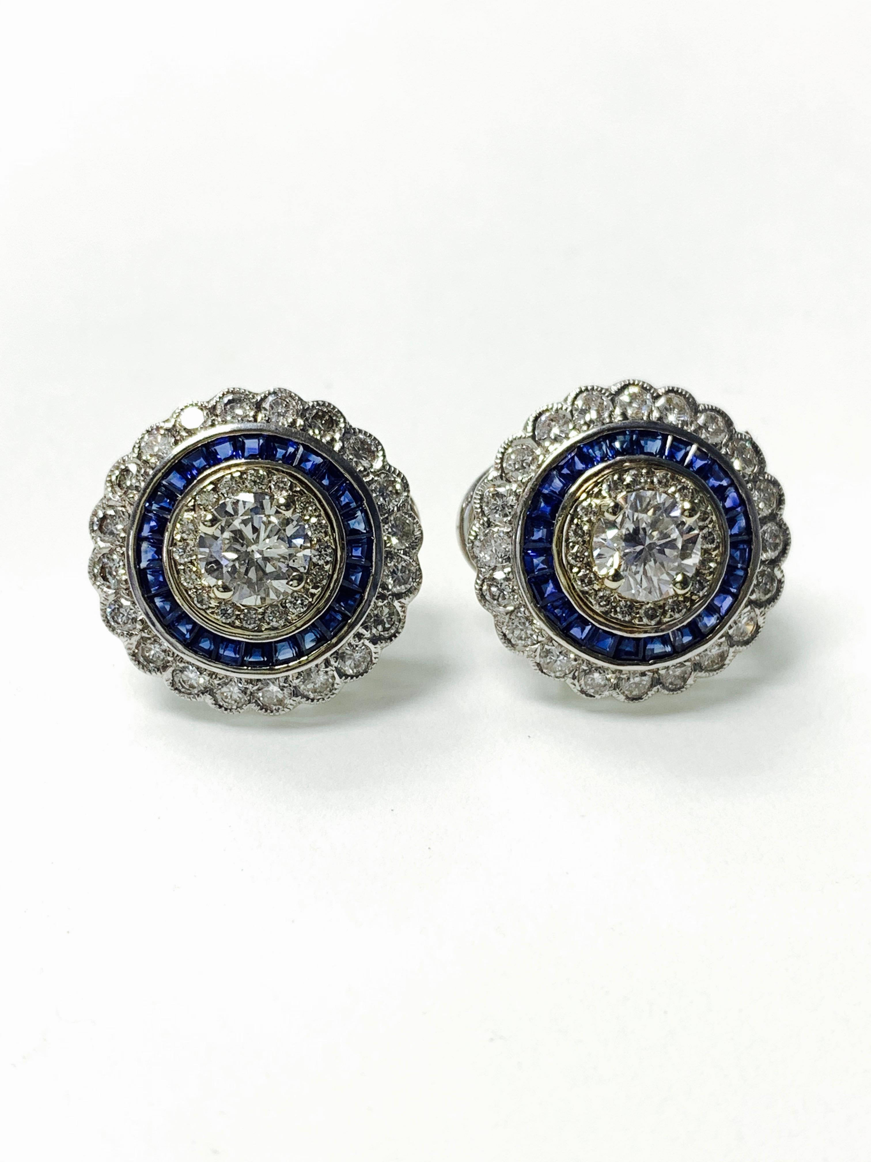 Gorgeous Diamond and blue sapphire stud earrings handcrafted in 18k white gold. 
The details are as follows: 
Diamond weight: 1.16 carat (center ) + 2 carat 
Blue sapphire weight: 0.75 carat 
Metal: 18K white gold 
Dimensions: 16.5mm 
