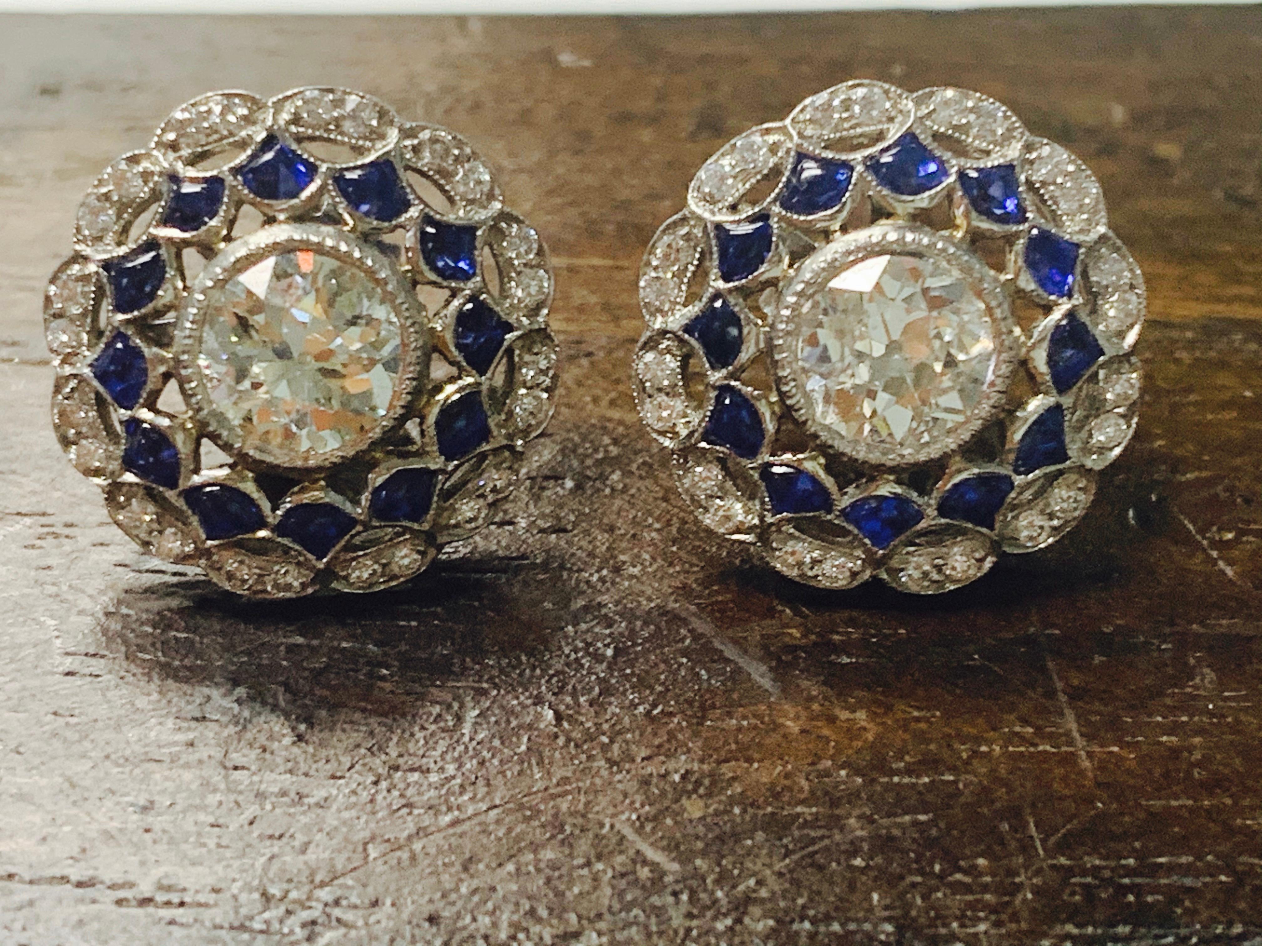 One of kind handcrafted diamond and blue sapphire stud earrings in platinum. 
The details are as follows: 
Diamond weight: 1.45 carat ( IJ color and SI clarity ) 
Blue sapphire weight: 0.70 carat 
Measurements: 15mm 
Metal: Platinum


