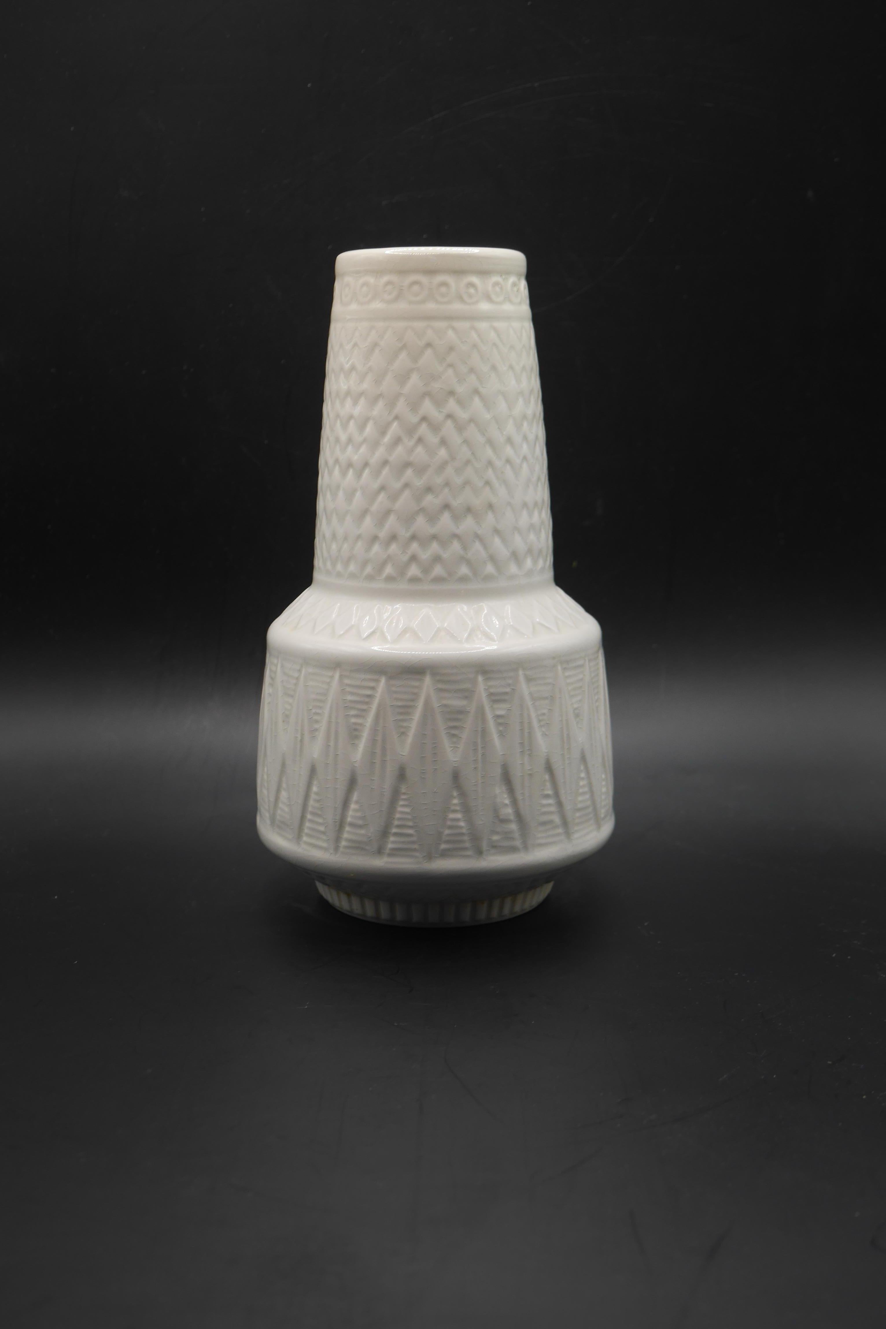 An unusual white version of the 'Oliv' vase by Gunnar Nylund, with intricate patterning on the body of the white glazed vase. 

Rörstrand porcelain was one of the most famous Swedish porcelain manufacturers, with production initially at